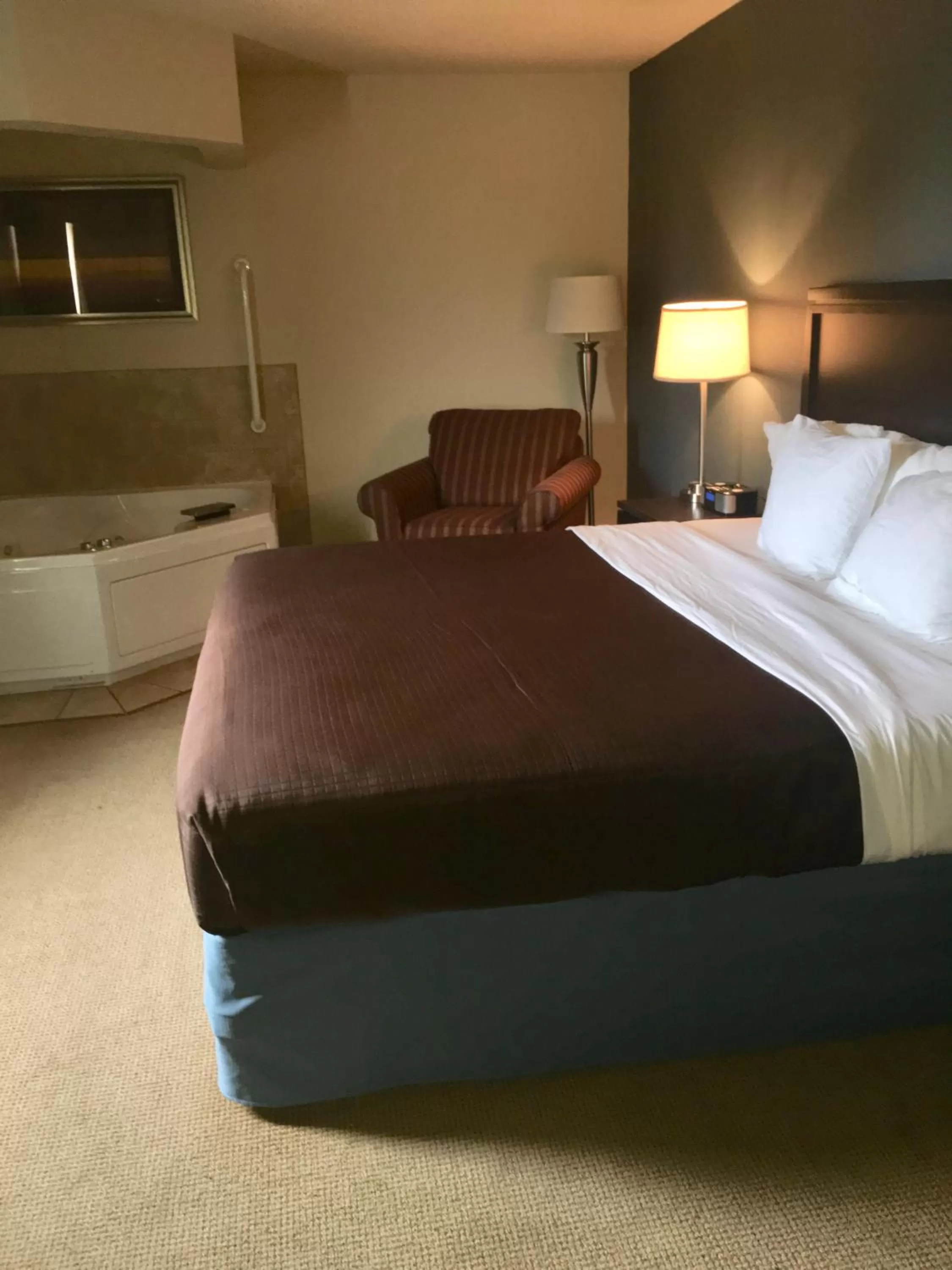 Bed in AmericInn by Wyndham Monmouth