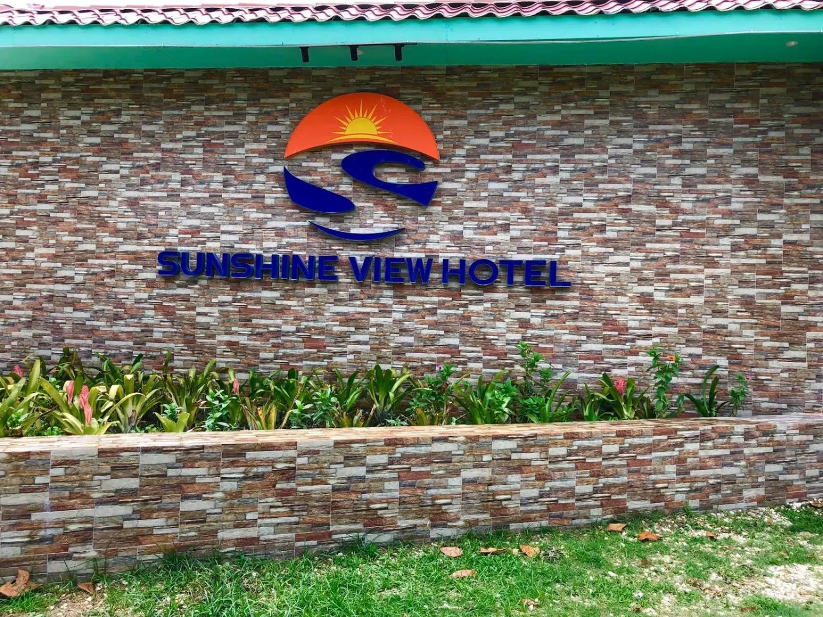 Property logo or sign in Sunshine View Hotel and Restaurant