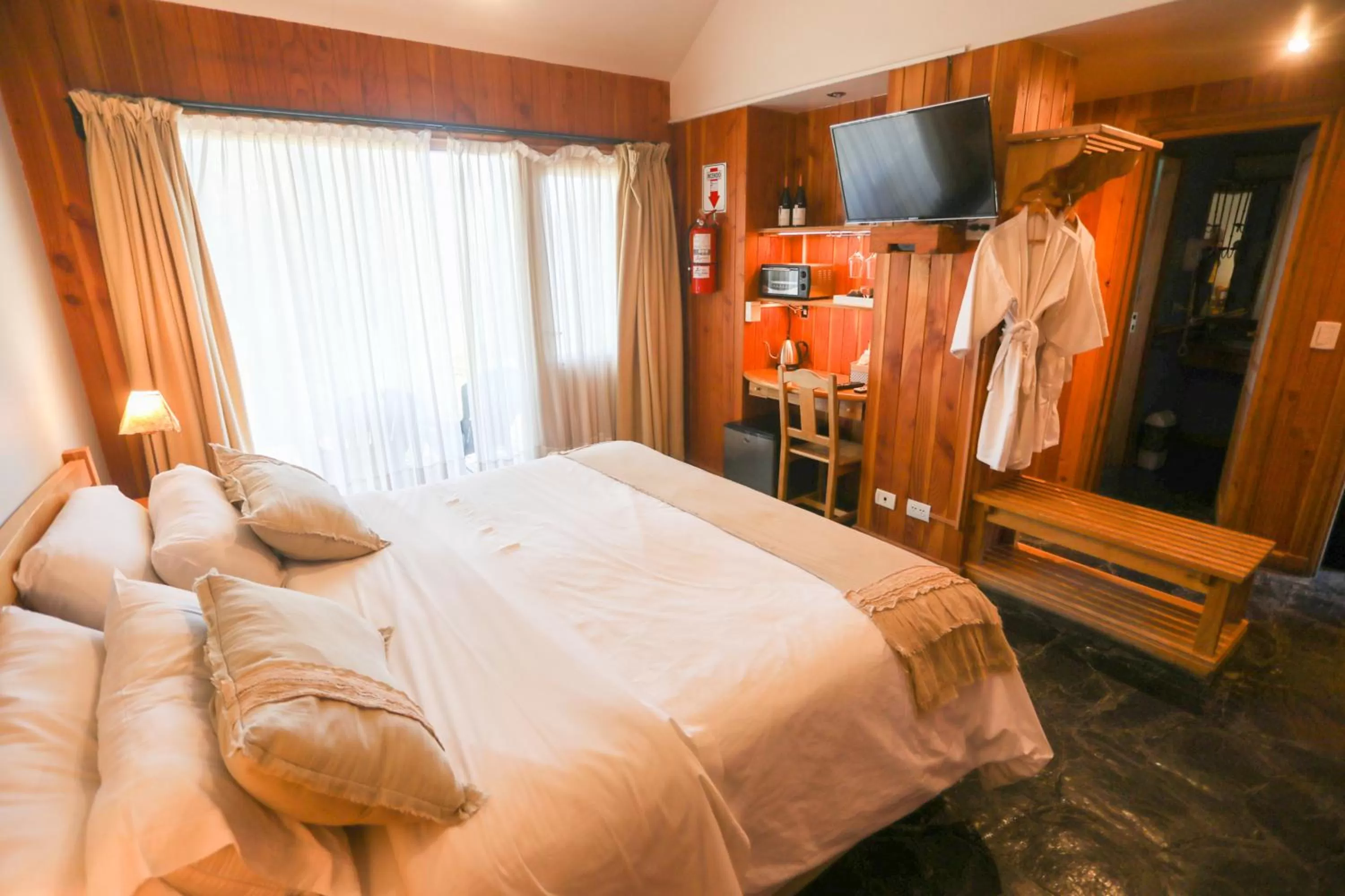 Communal lounge/ TV room, Bed in Arrayan Lake View Mountain Lodge & Casa De Te Arrayan