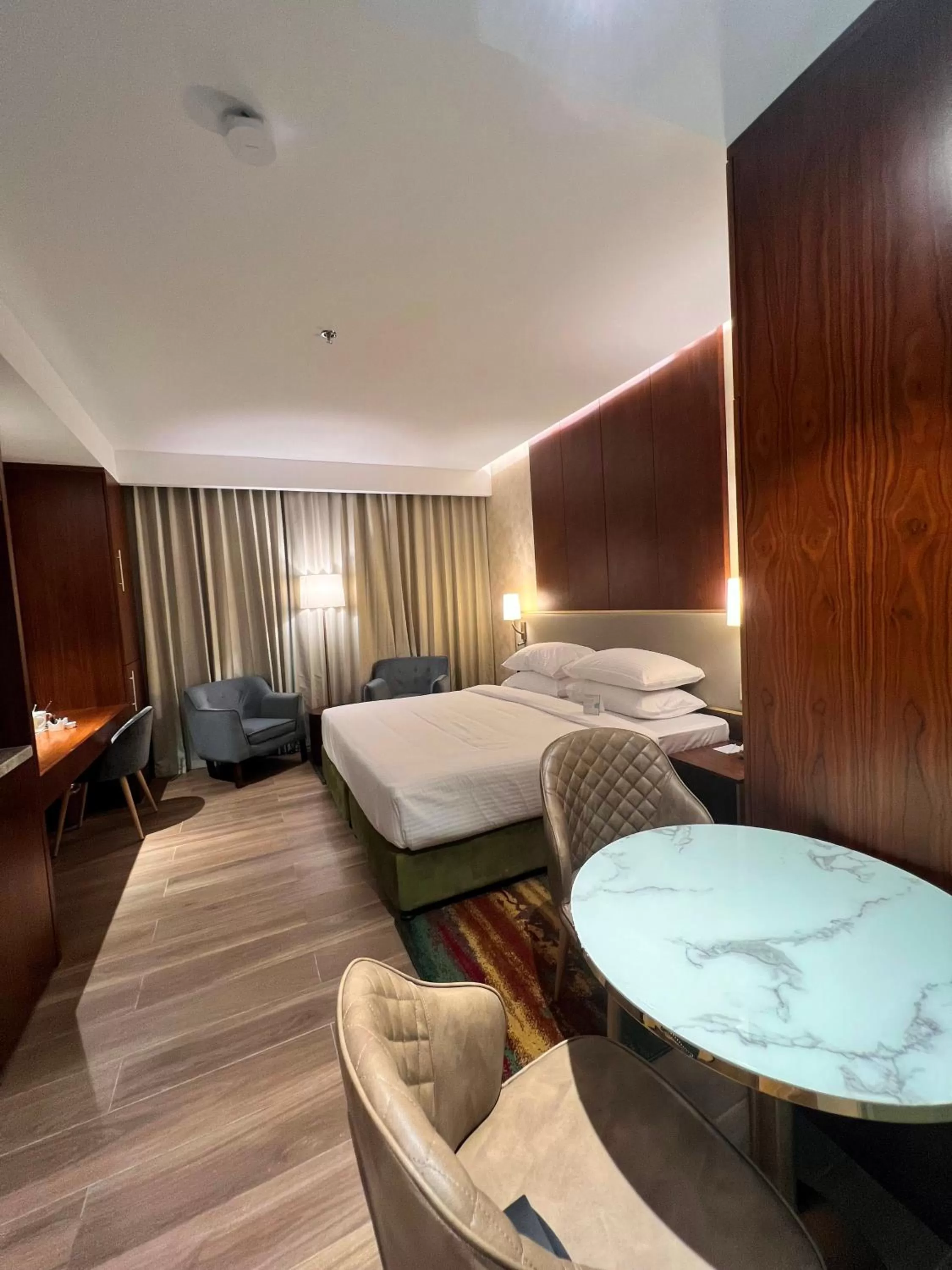 Bedroom, Bed in City Seasons Suites