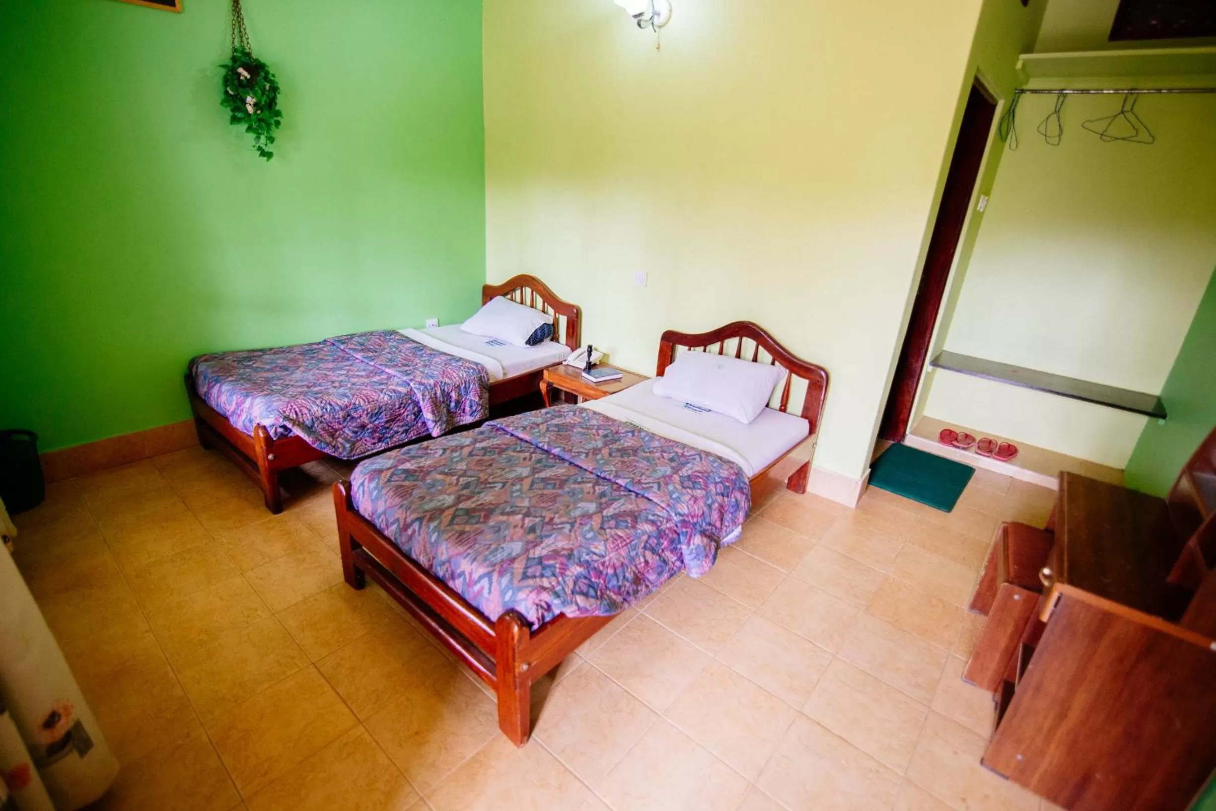 Bed in Bunyonyi Overland Resort