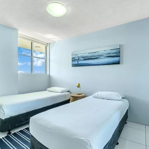 Bed in Tradewinds Apartments