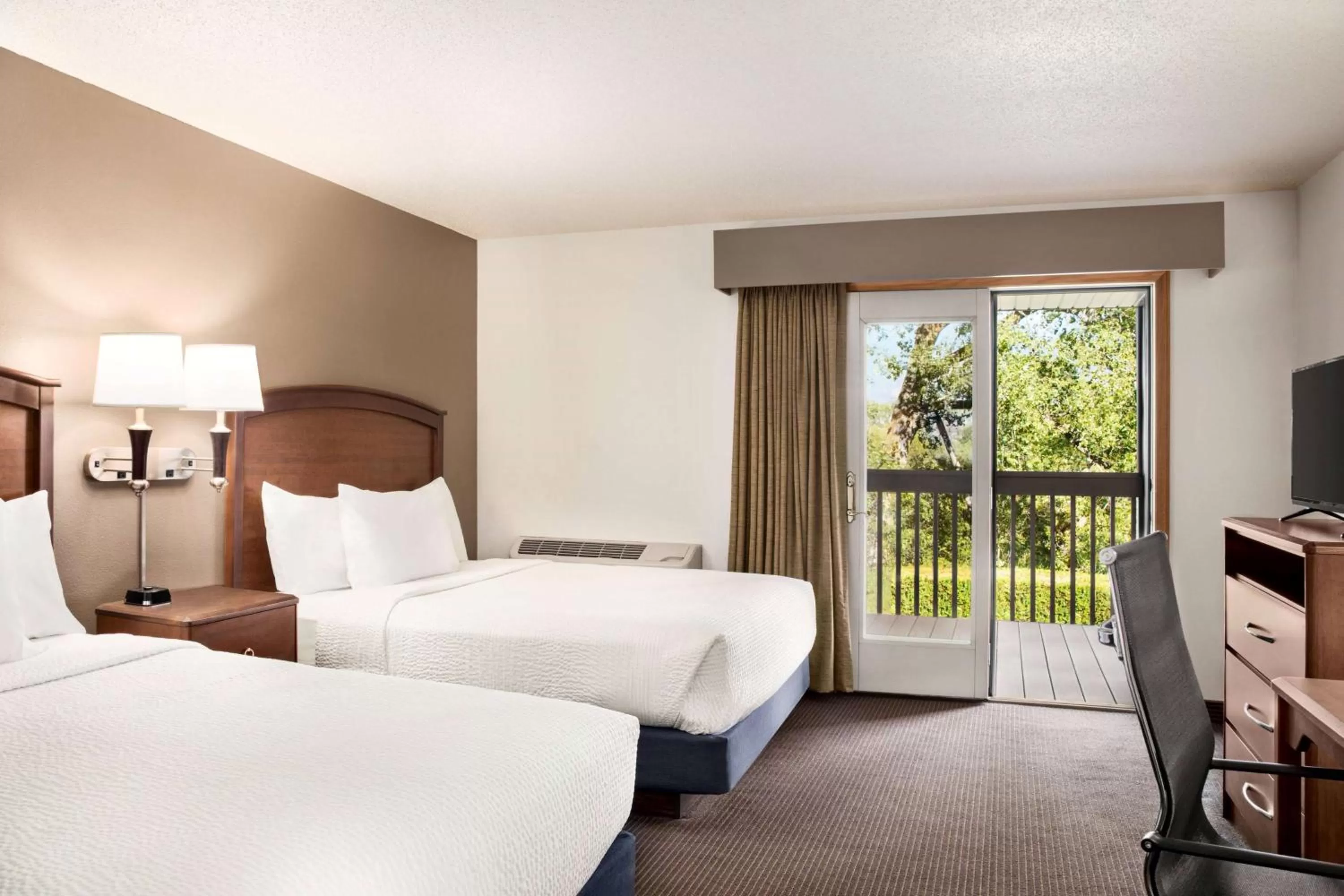 Bed in AmericInn by Wyndham Baudette