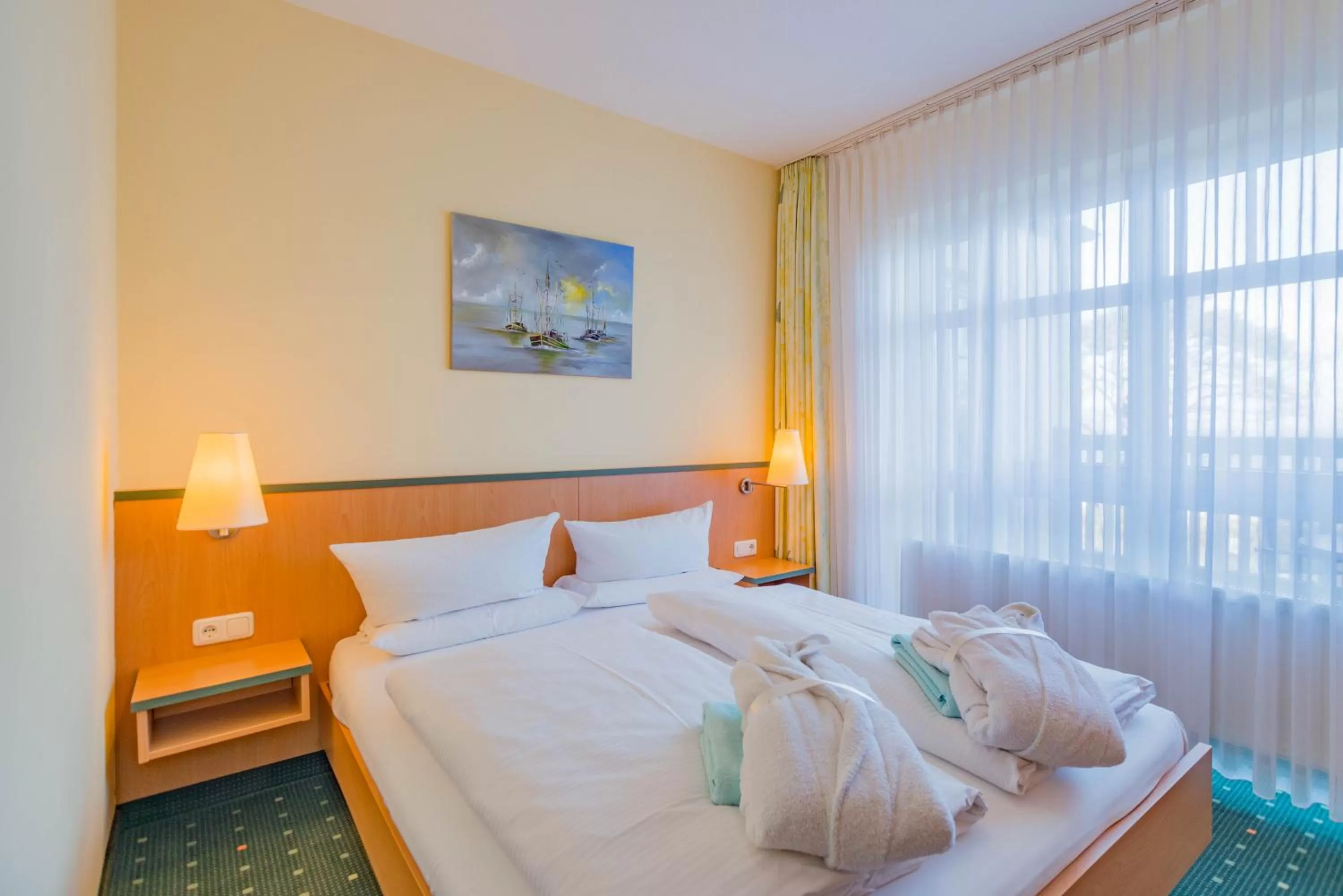 Photo of the whole room, Bed in Am Weststrand Aparthotel Kühlungsborn