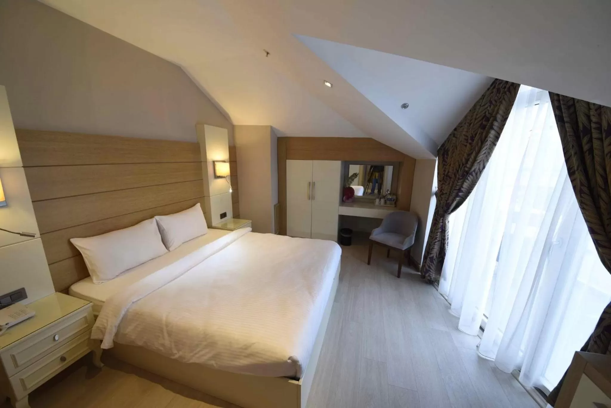 Bed in Hotel Le Mirage