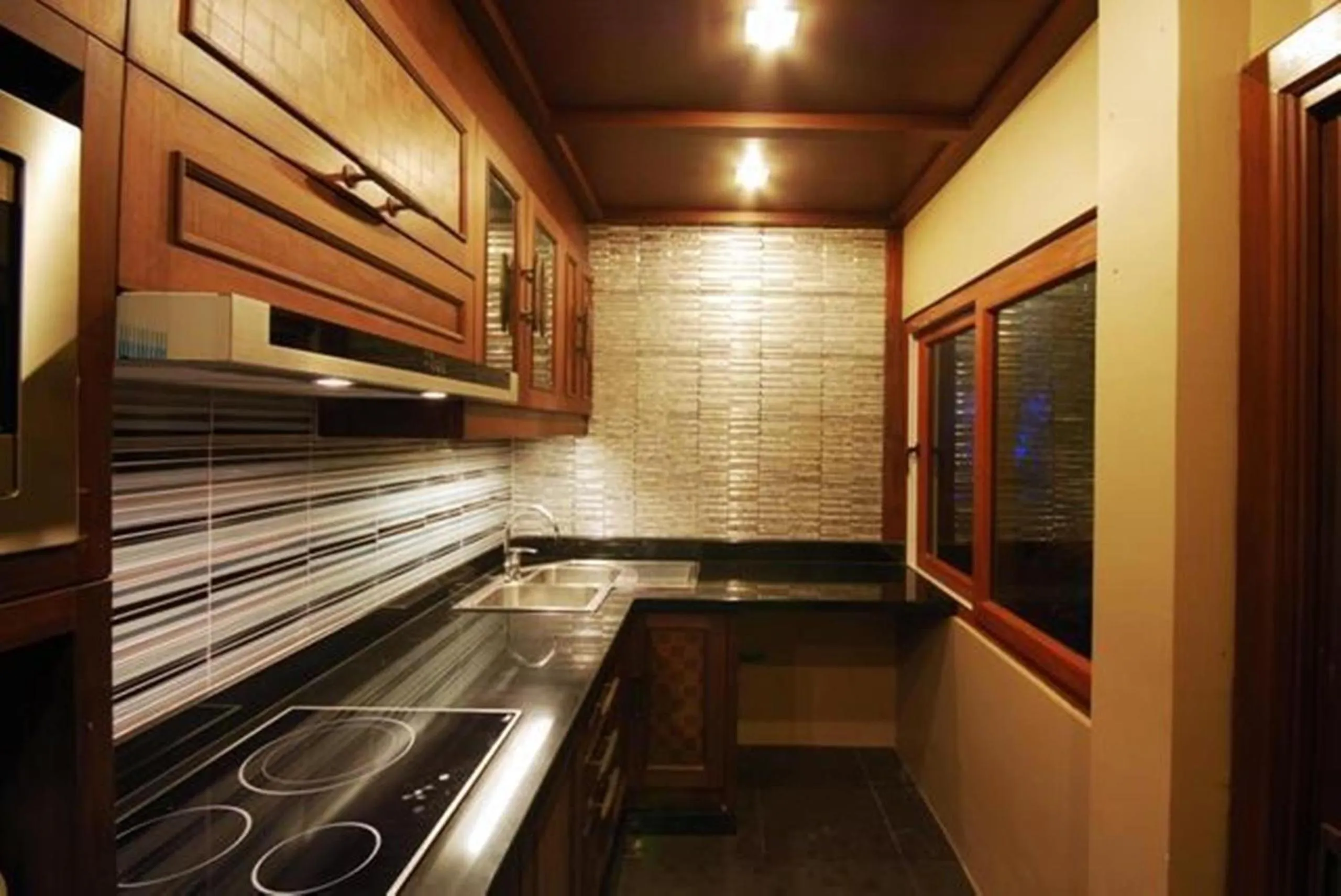 Kitchen or kitchenette in Ammatara Pura Pool Villa