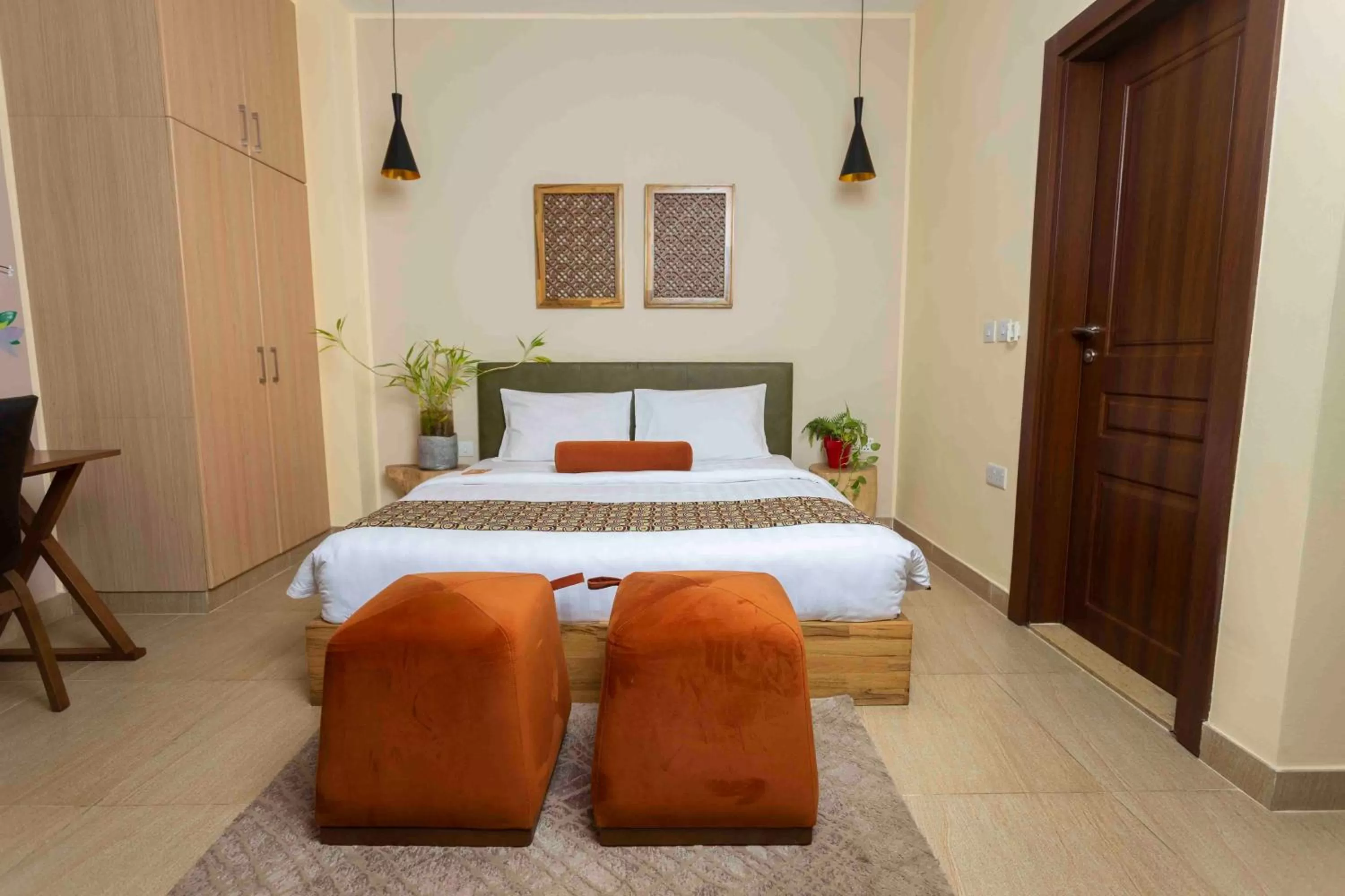 Bed in Roots Hotel Apartment