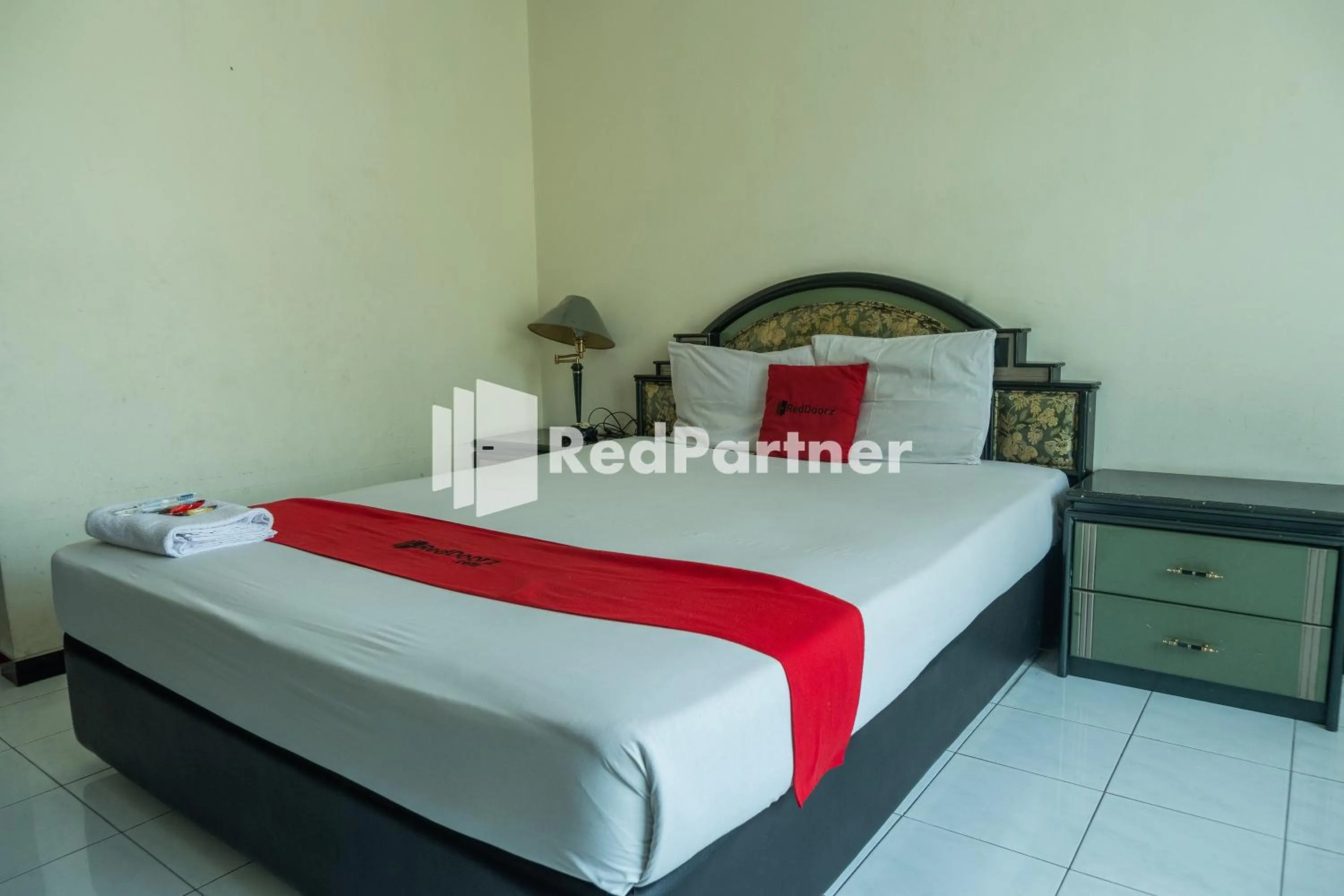 Bed in Akur Hotel Malioboro Mitra RedDoorz