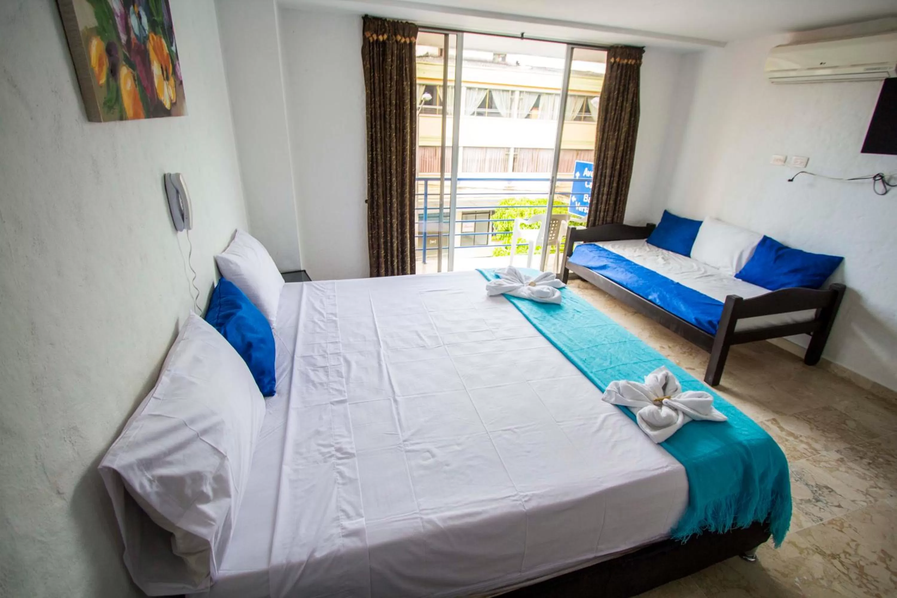 Bed in Blue Star Hotel