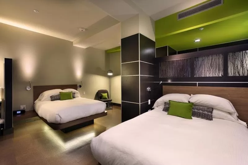 Bed in CityFlatsHotel - Grand Rapids, an Ascend Collection Hotel