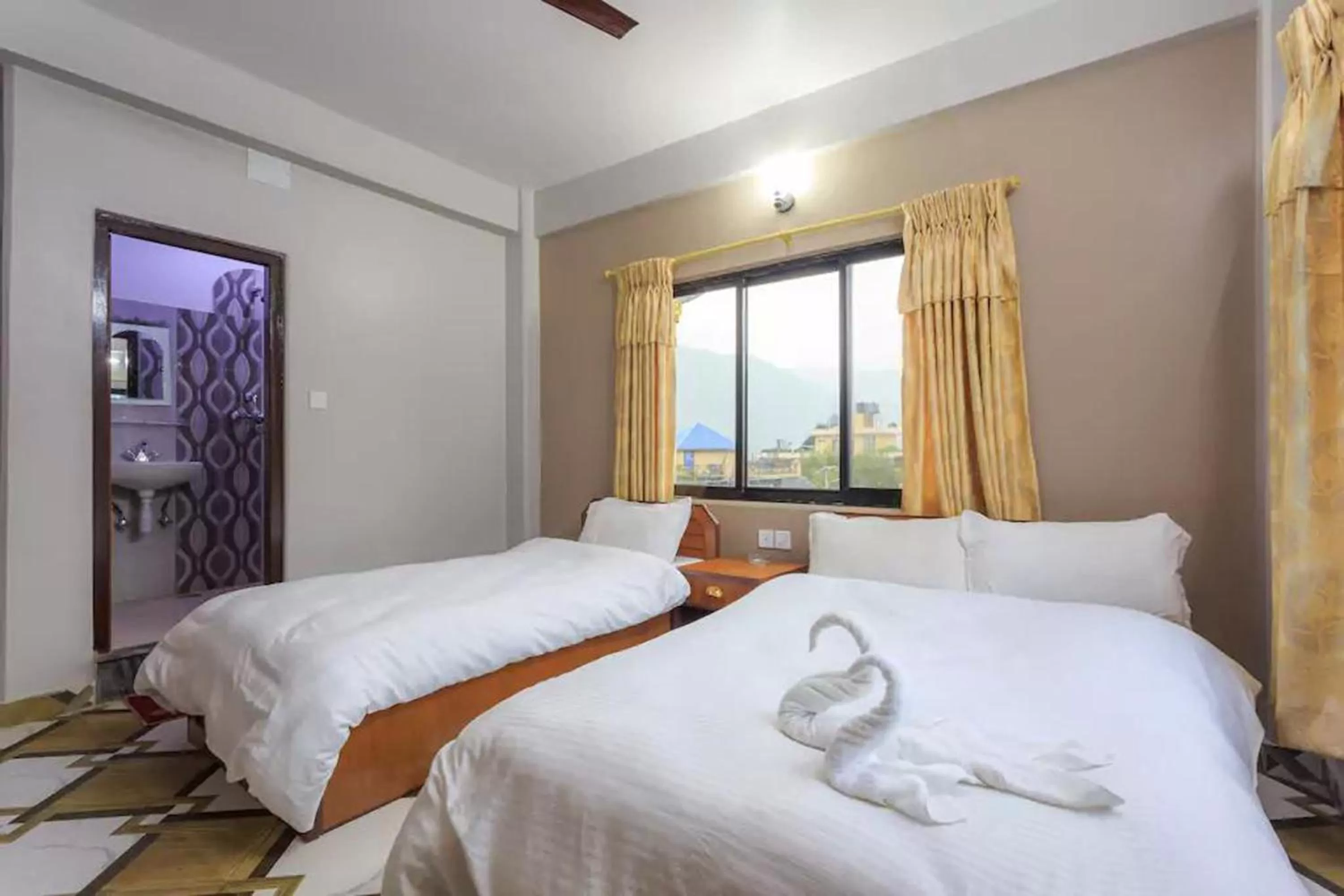 Bed in Hotel Immortal Inn