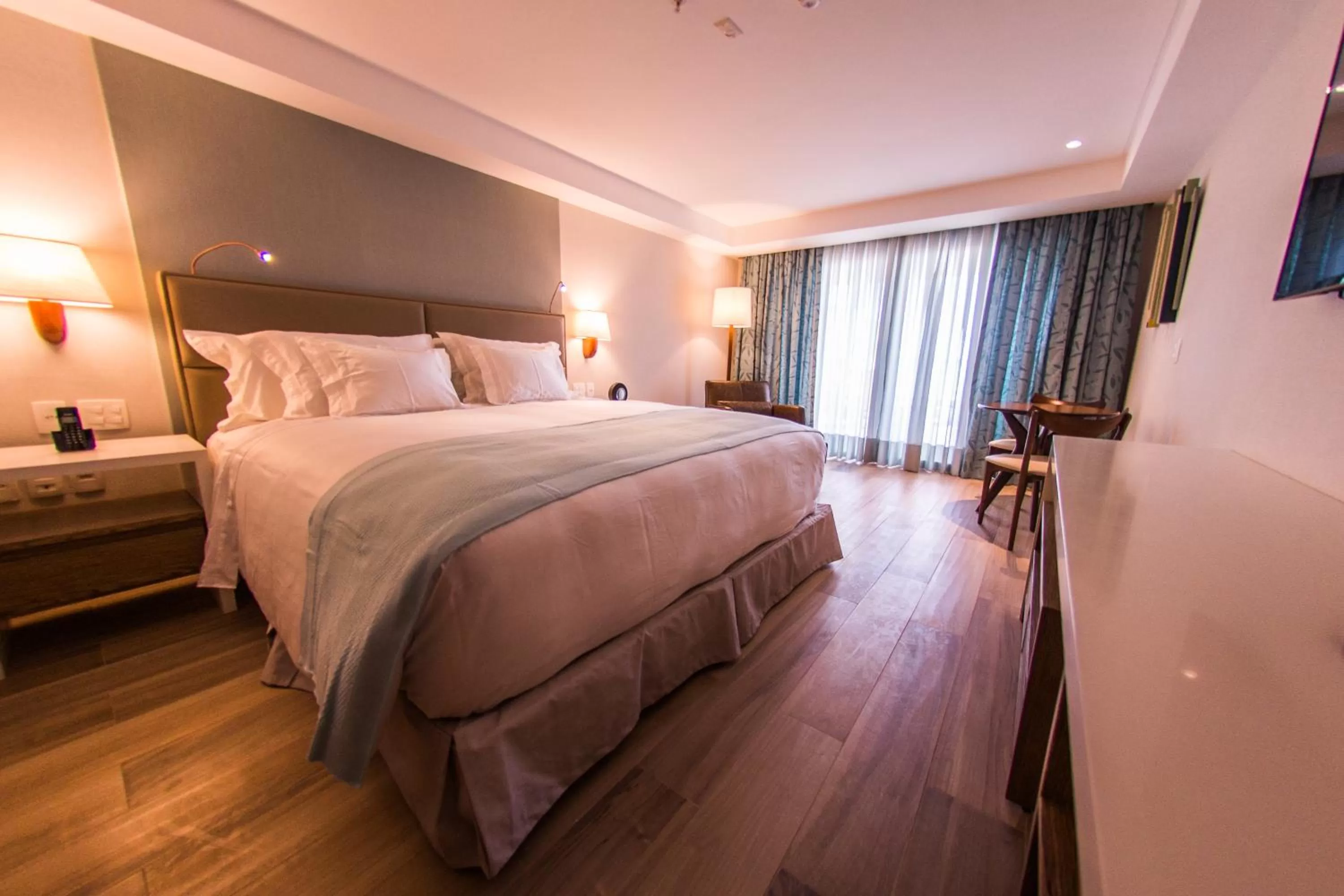 Bed in Vogal Luxury Beach Hotel & SPA