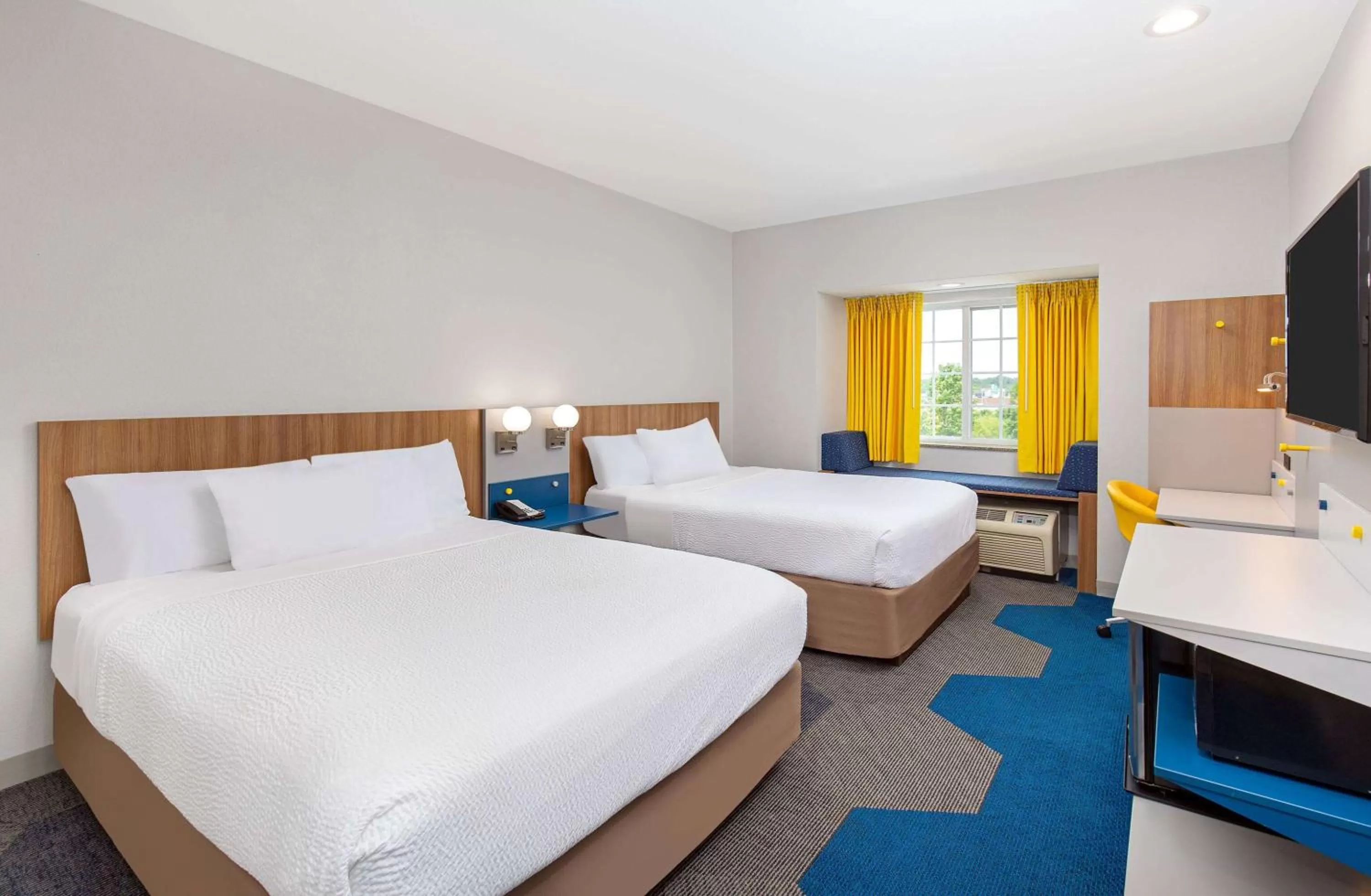 Bed in Microtel Inn and Suites by Wyndham