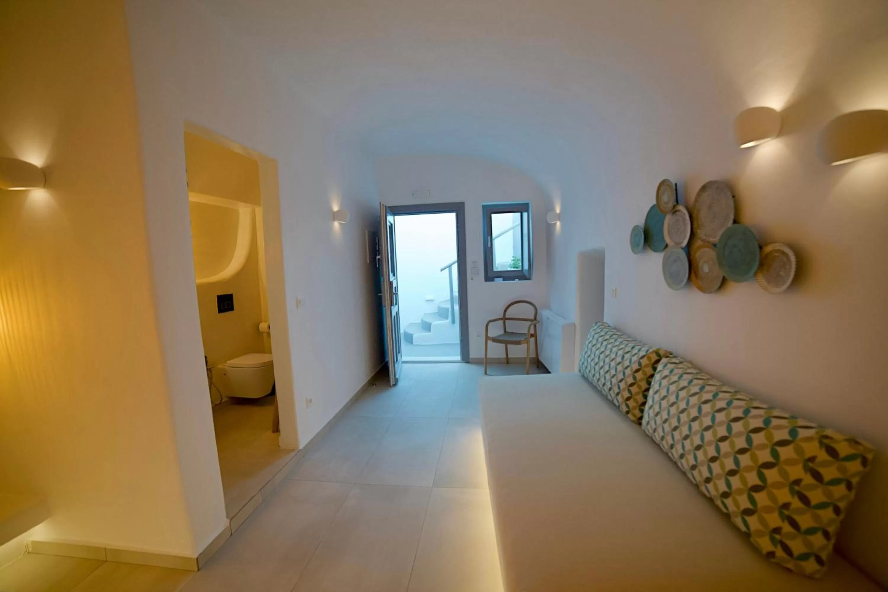 Living room, Bed in Eternity Suites Santorini