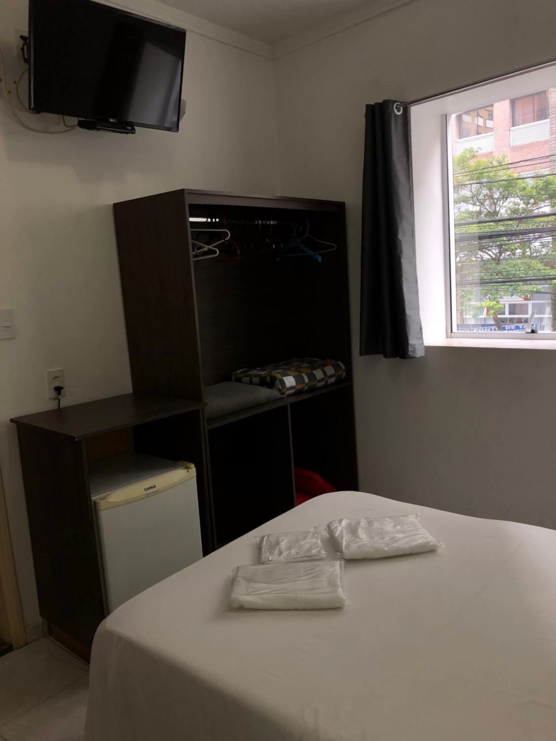 Bed in Center Plaza Hotel