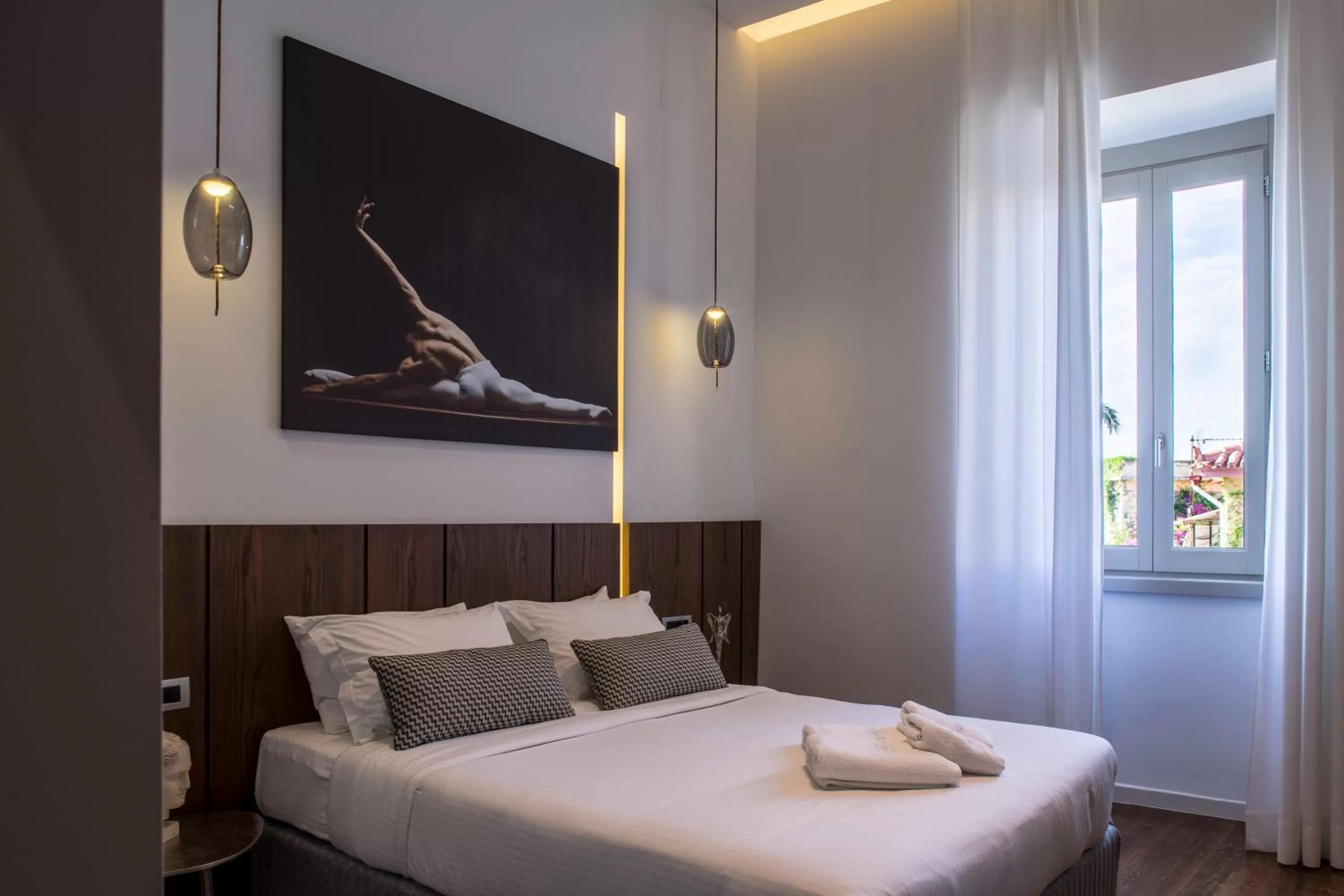Bed in Gambello Luxury Rooms