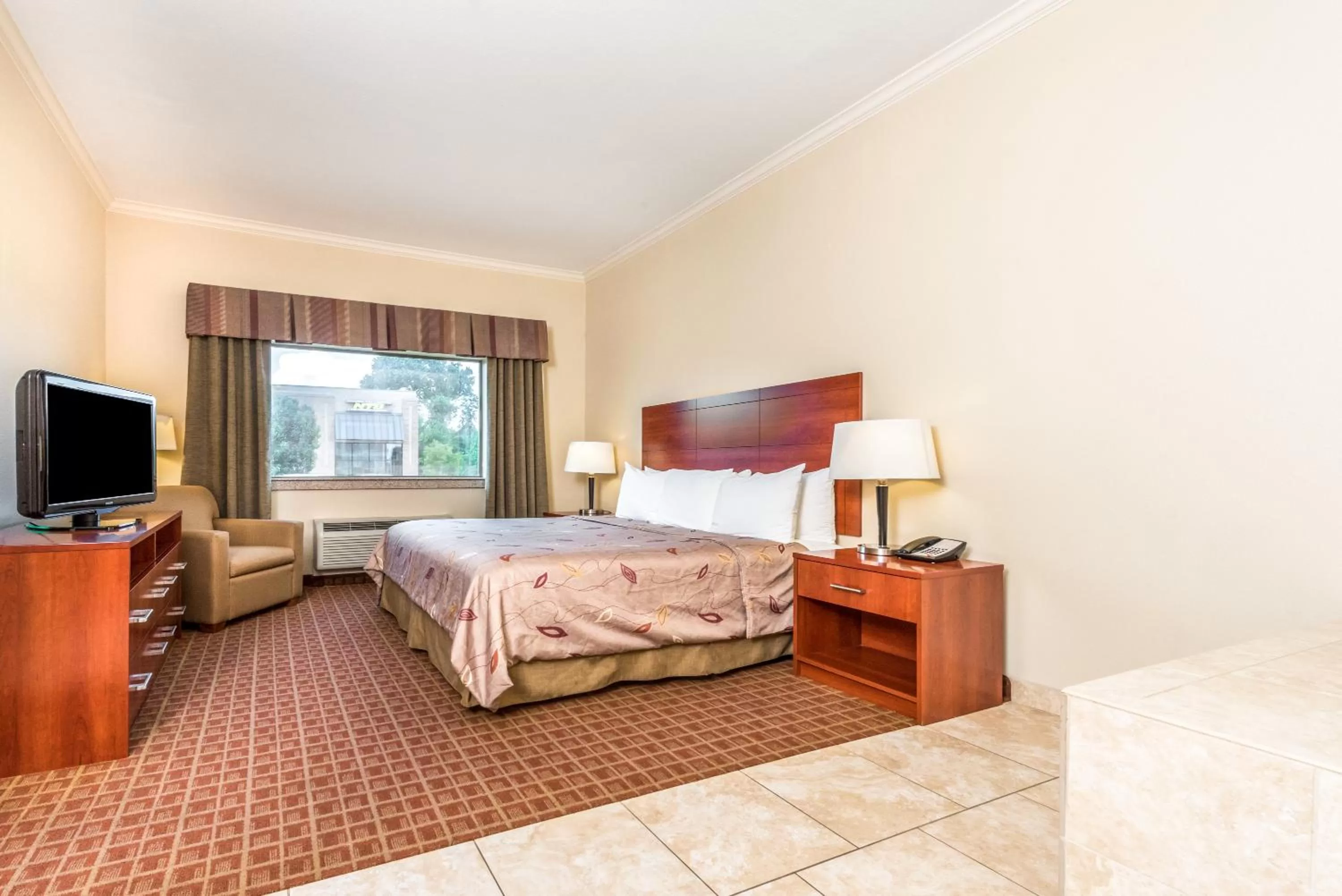 Photo of the whole room, Bed in Ramada by Wyndham College Station