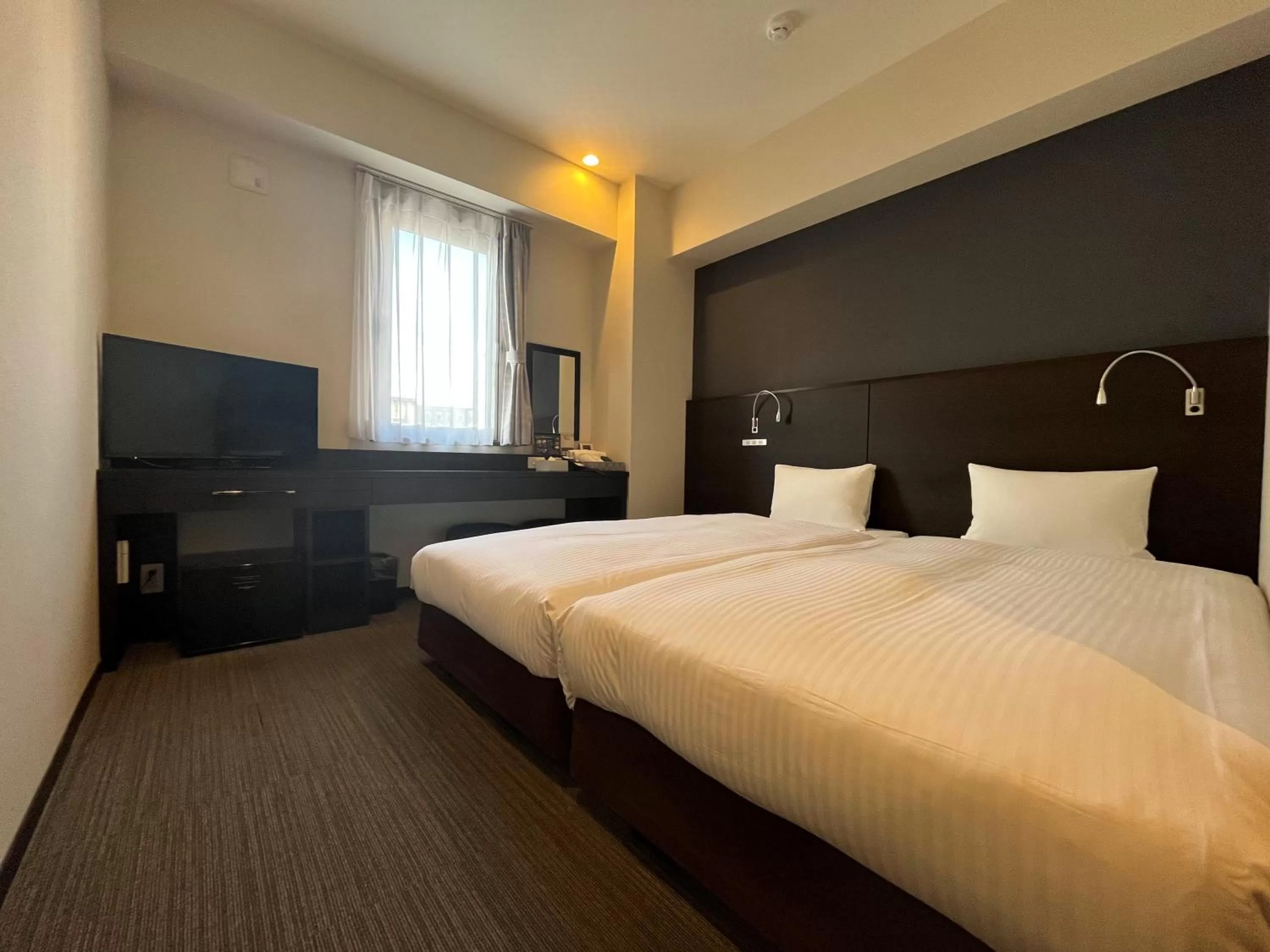 Bed in The BREAKFAST HOTEL Fukuoka Tenjin