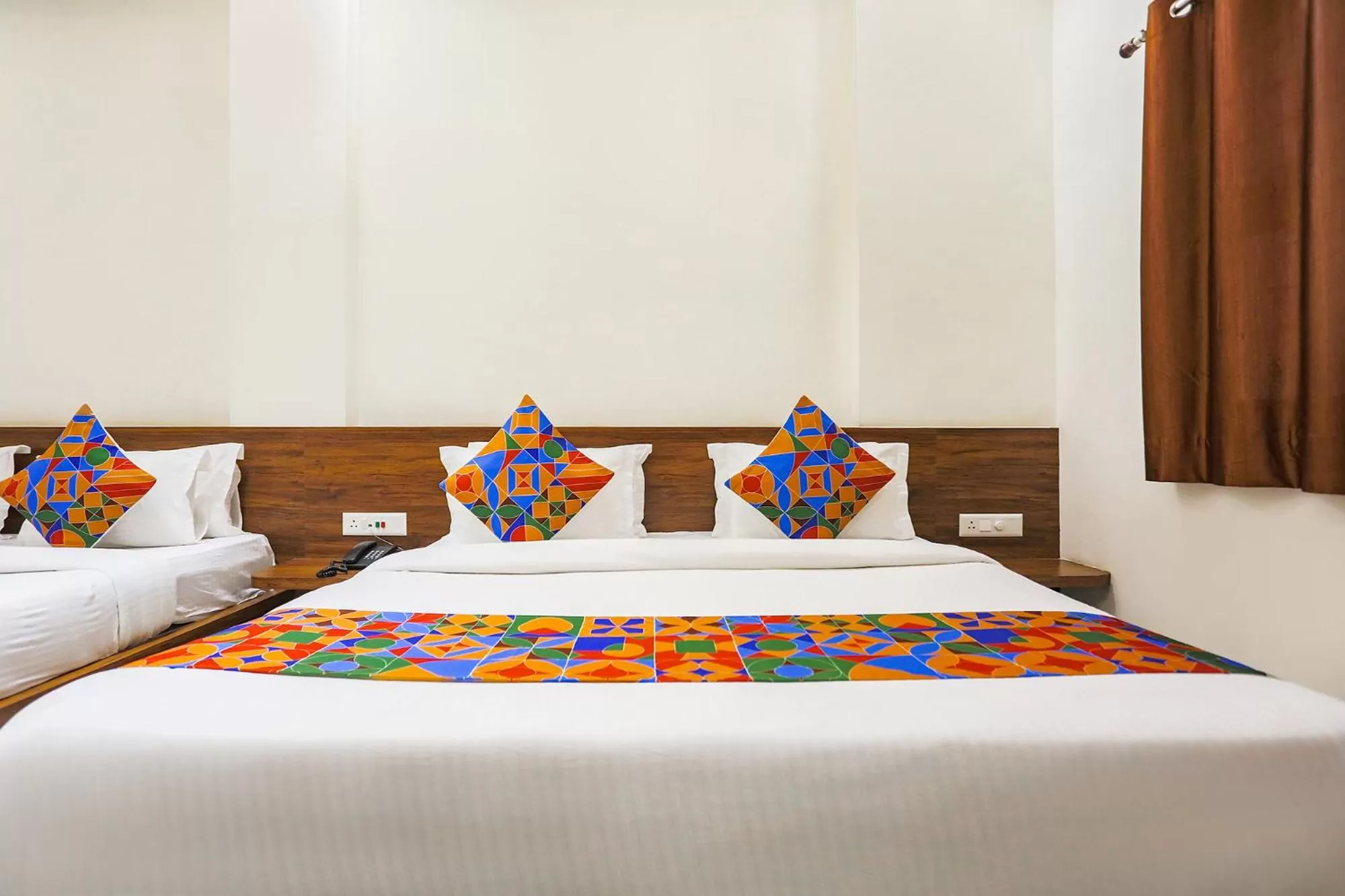 Bed in FabHotel Balaji Paradise