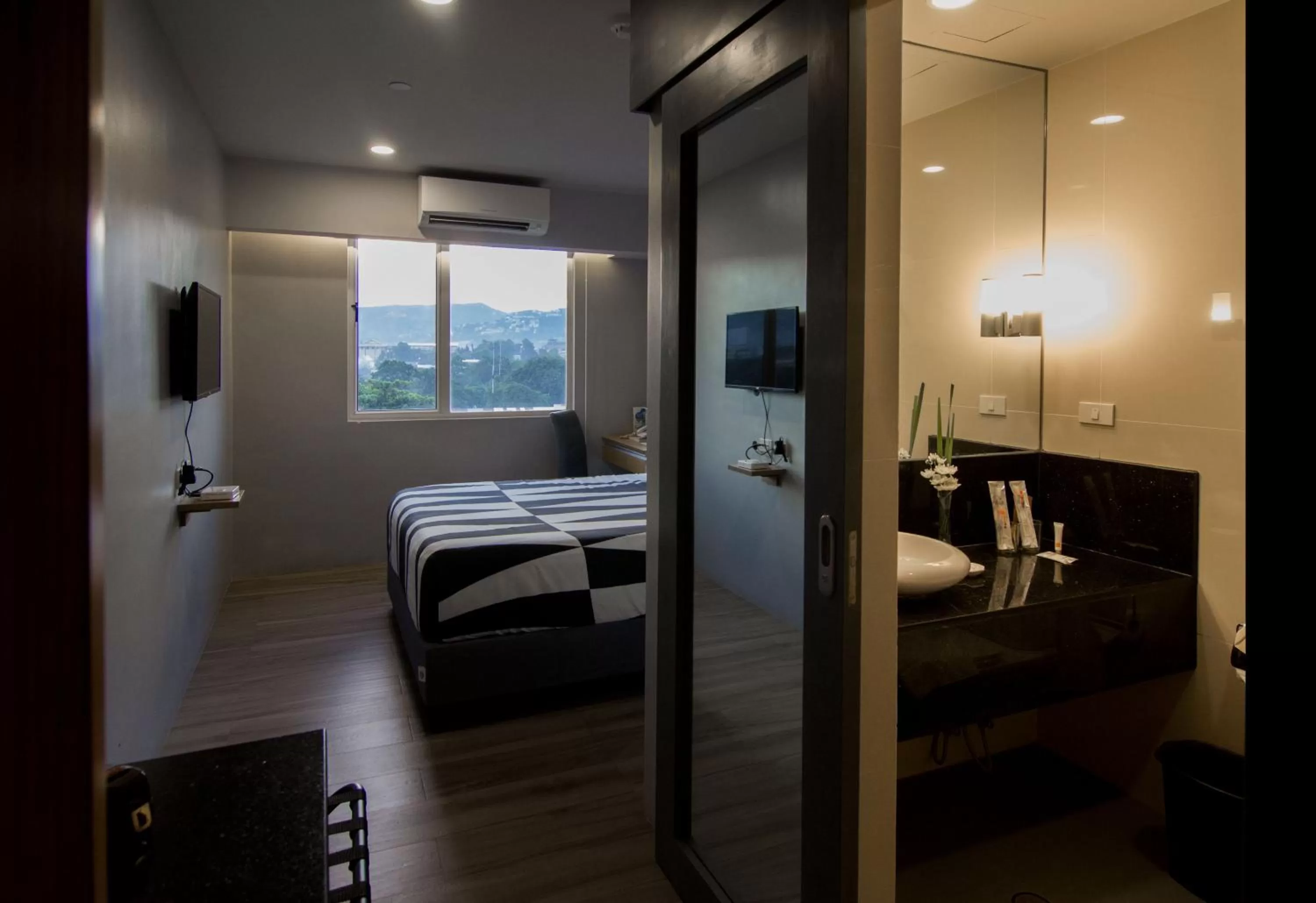 Photo of the whole room, Bed in Cebu Hotel Plus