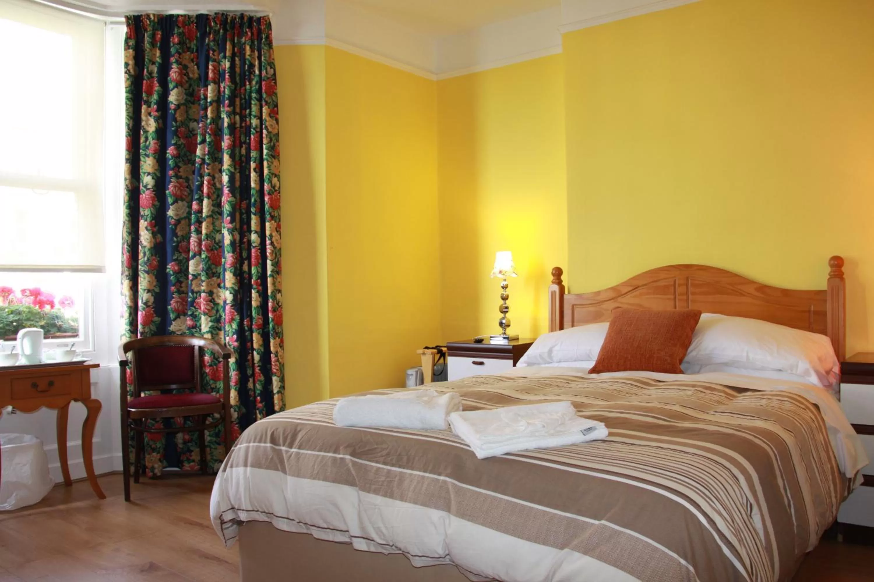 Bed in Ambassador Hotel