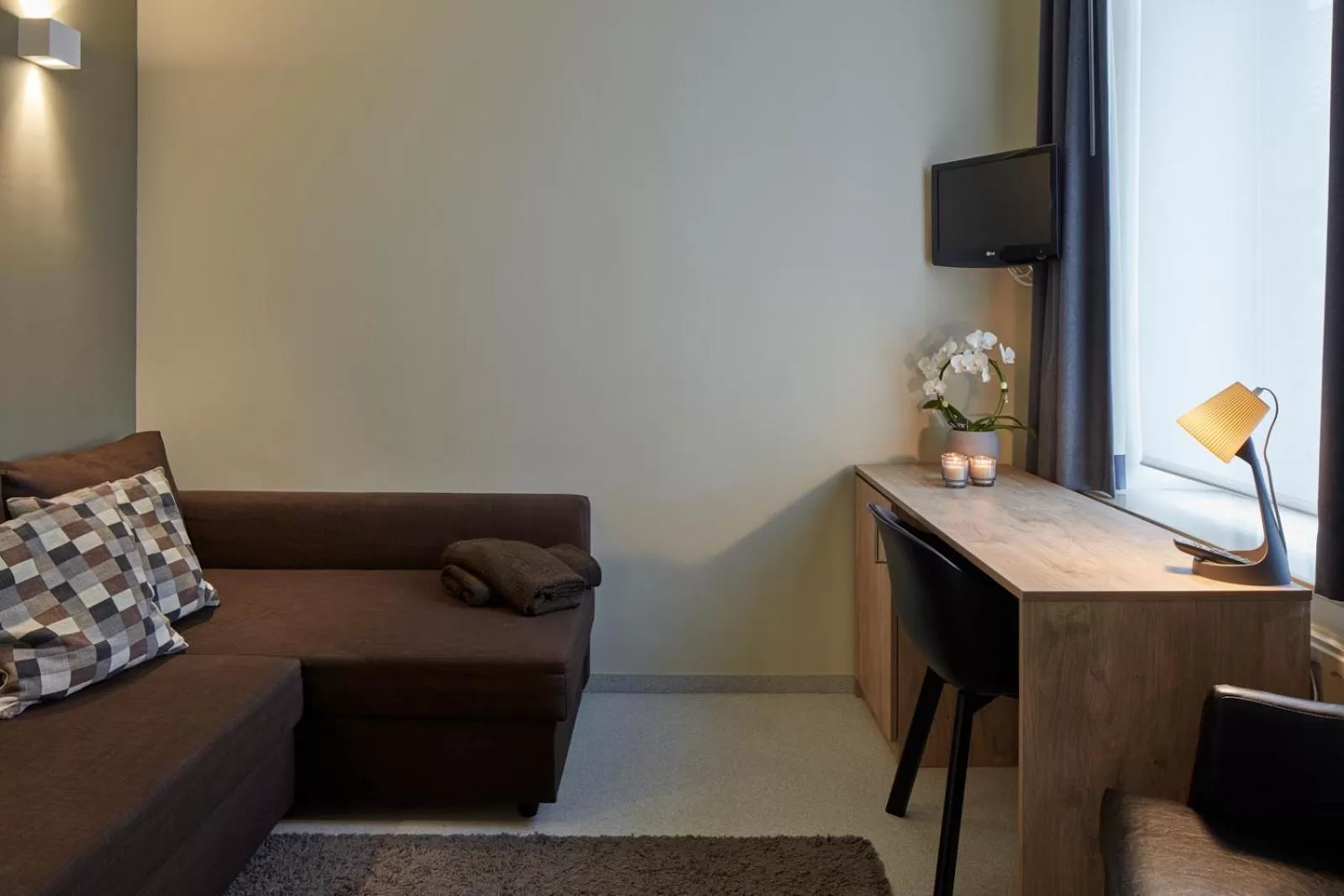 Seating area in Alpha Hotel and Aparthotel