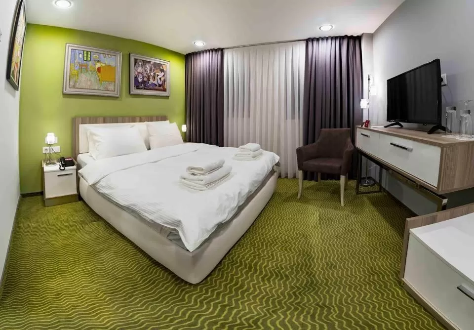 Photo of the whole room, Bed in Central Hotel, Fitness and Spa