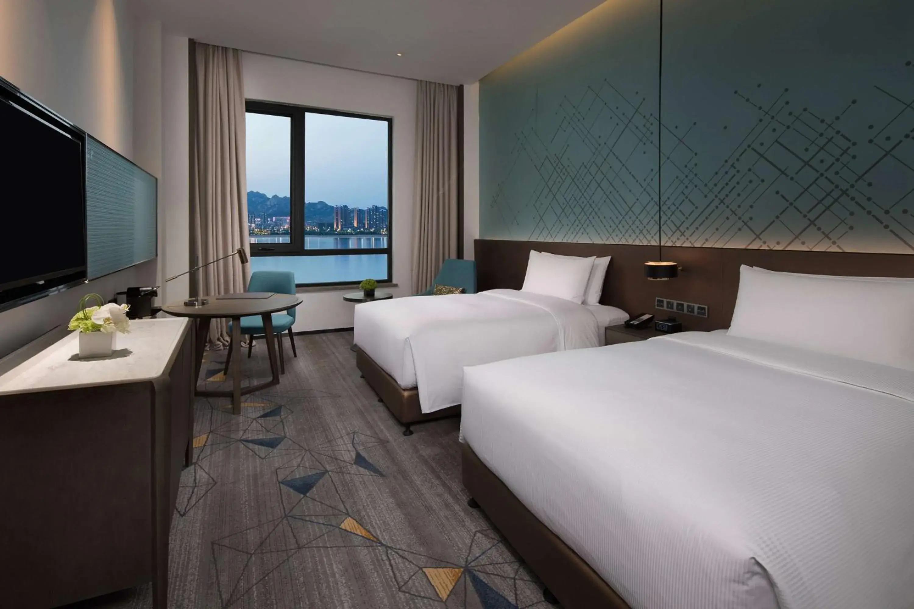 Executive Twin Room with Balcony and Sea View in Doubletree By Hilton Qingdao Oriental Movie Metropolis Executive Twin Room with Balcony and Sea View in Doubletree By Hilton Qingdao Oriental Movie Metropolis