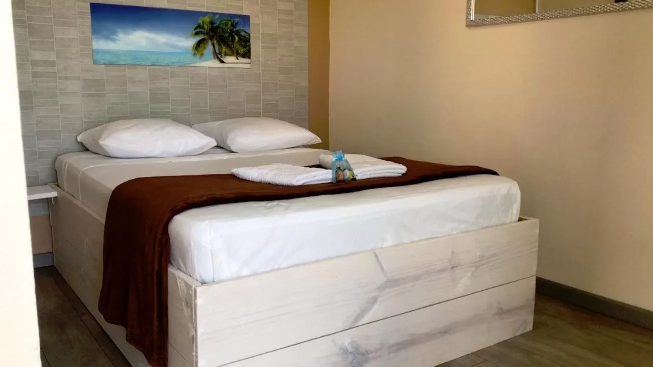 Bed in Hôtel Le Soleil Couchant