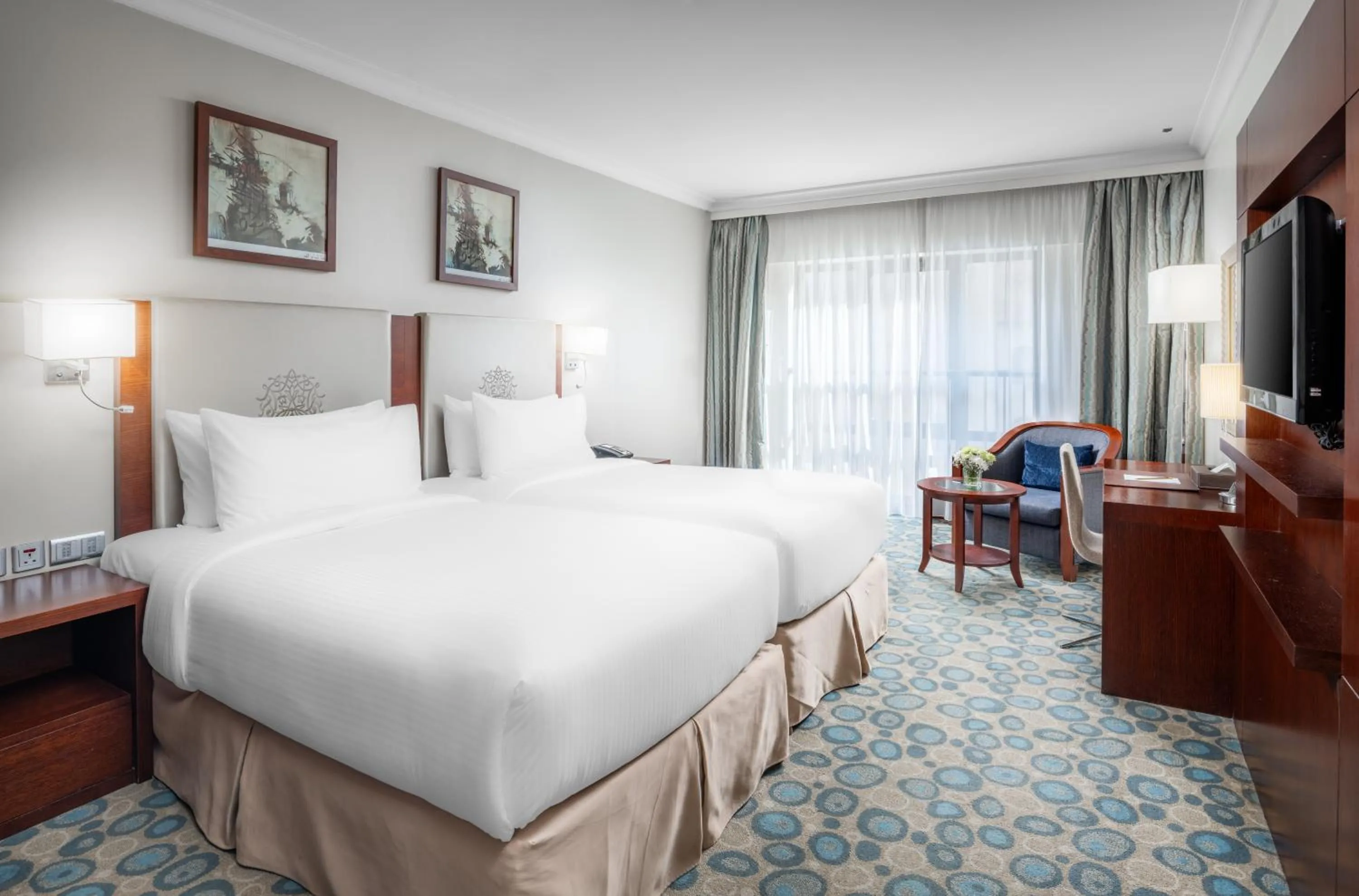 Bed in Millennium Al Aqeeq Hotel