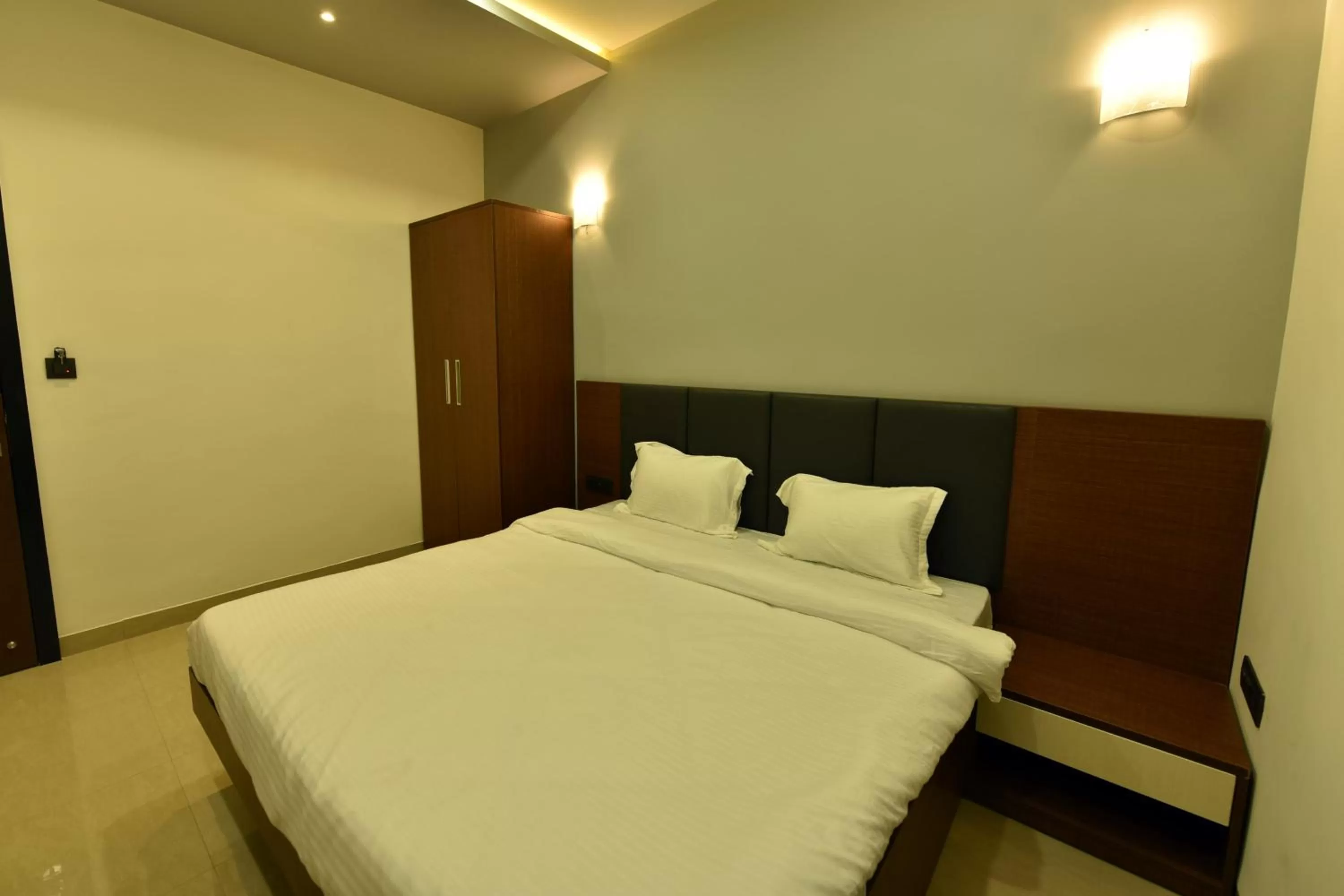 Bed in Hotel Nikhil Regency