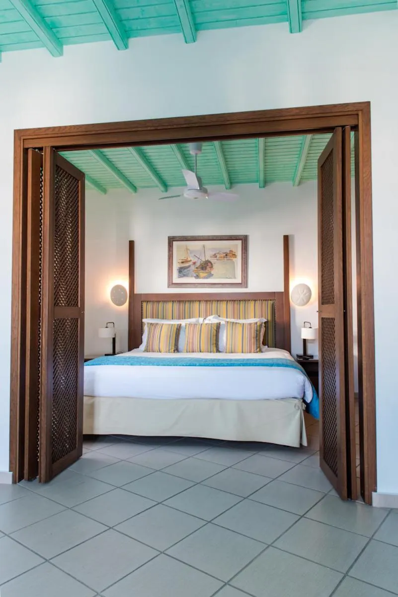 Bed in Poseidon Hotel Suites