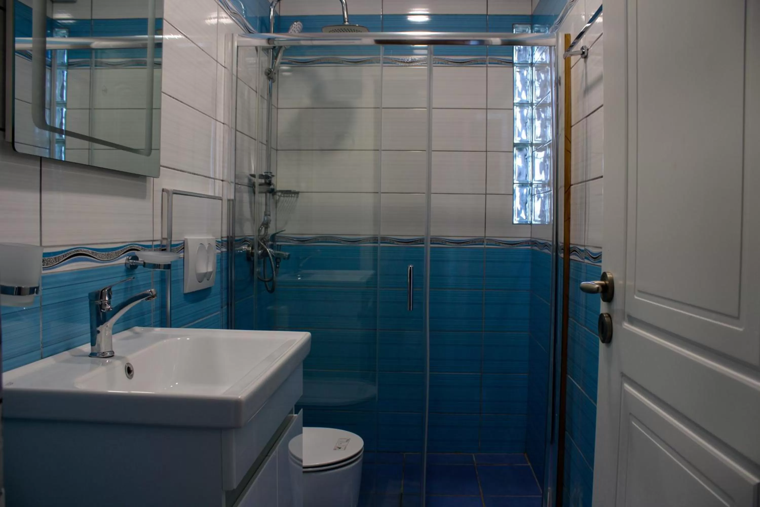 Bathroom in Aphrodite Garden Rooms & Apartment