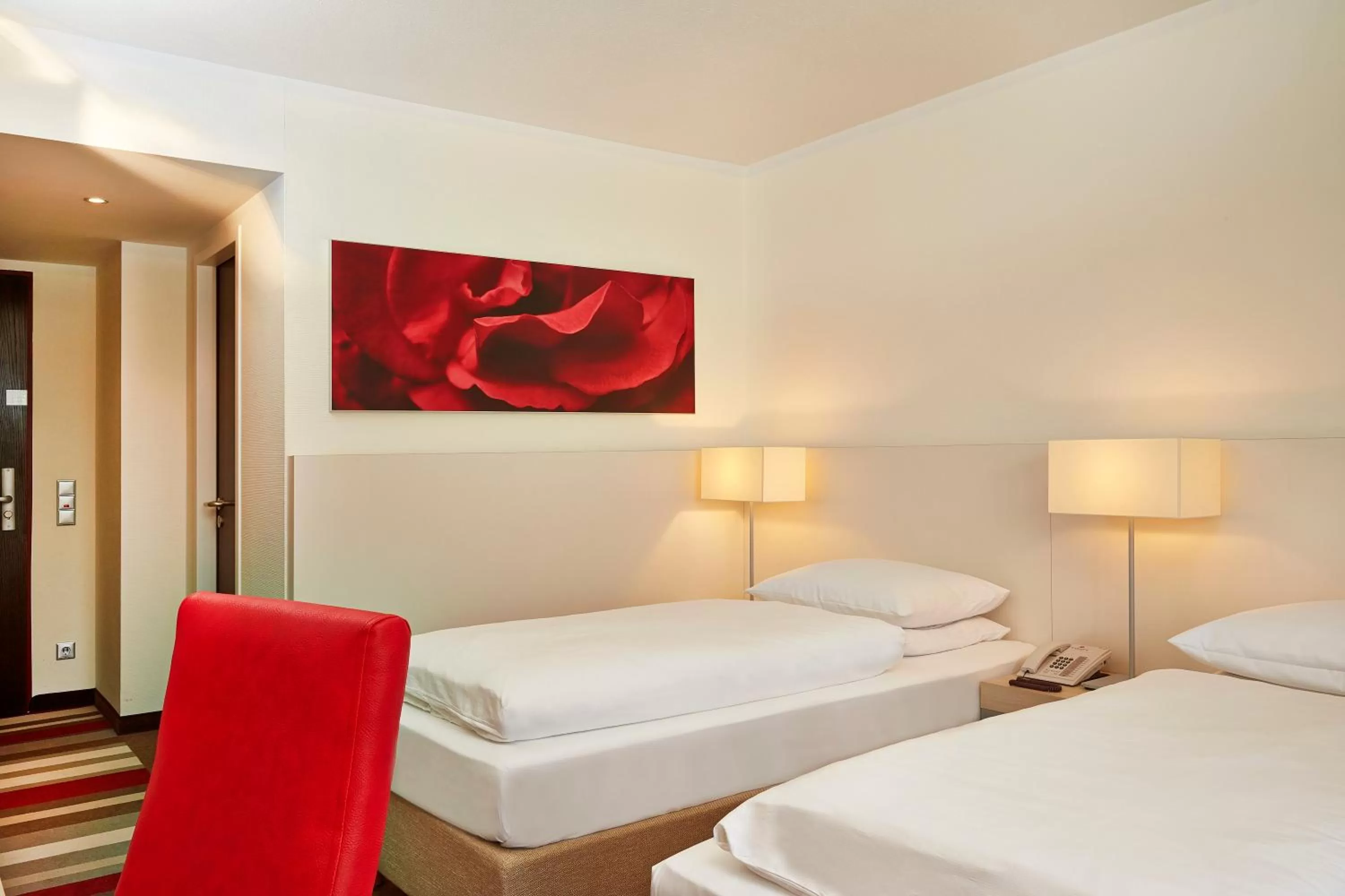Bedroom, Bed in H+ Hotel Bad Soden