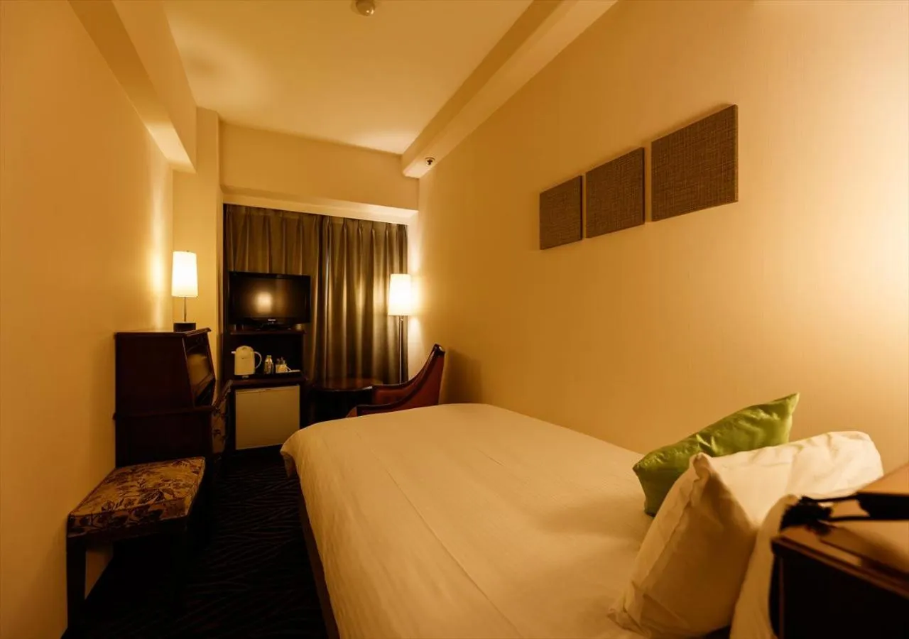 Bed in Kanazawa New Grand Hotel Prestige