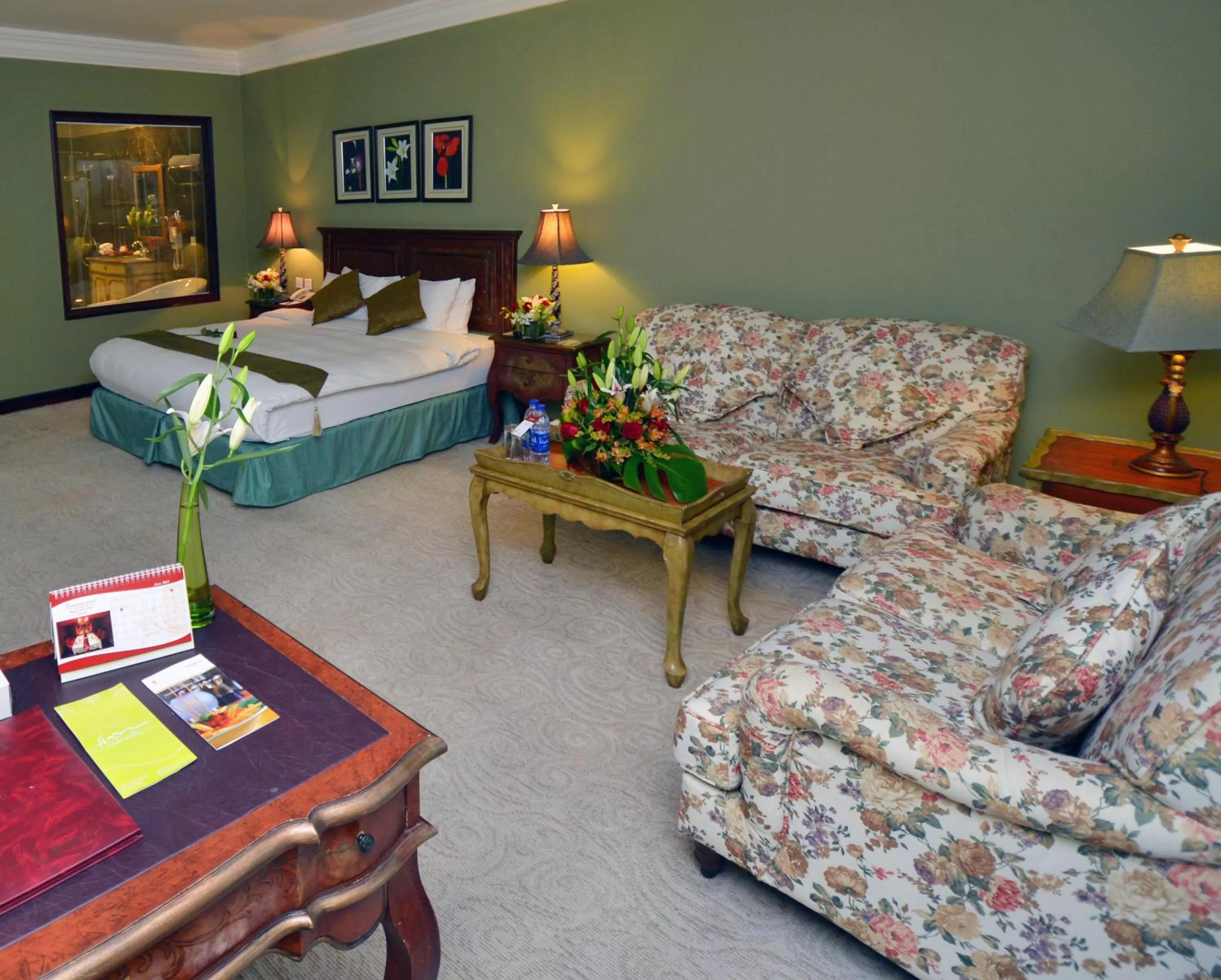 Living room, Bed in The Convention Center & Royal Suites Hotel