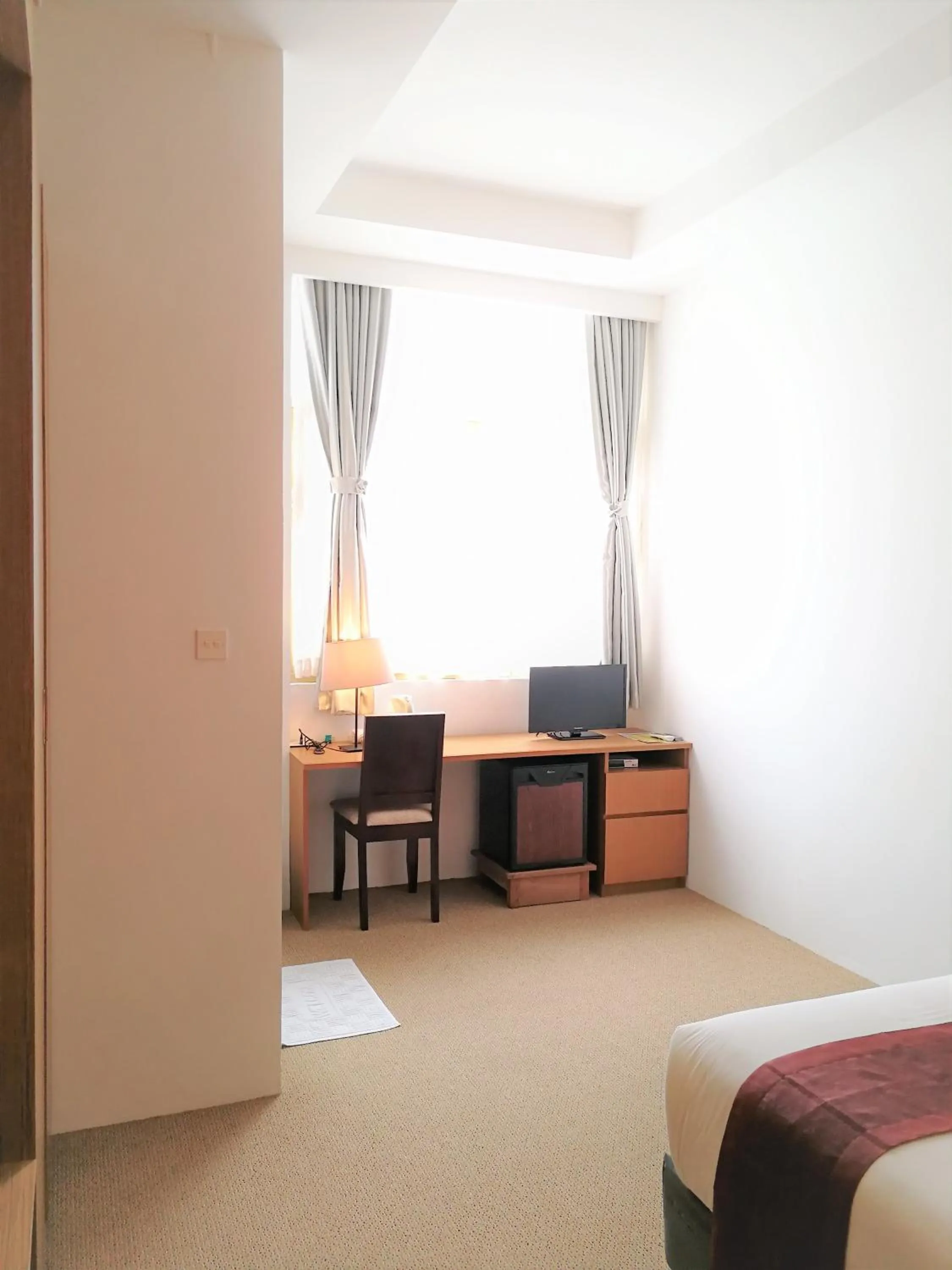 Living room, Bed in YAMA HOTEL & ROOFTOP BAR