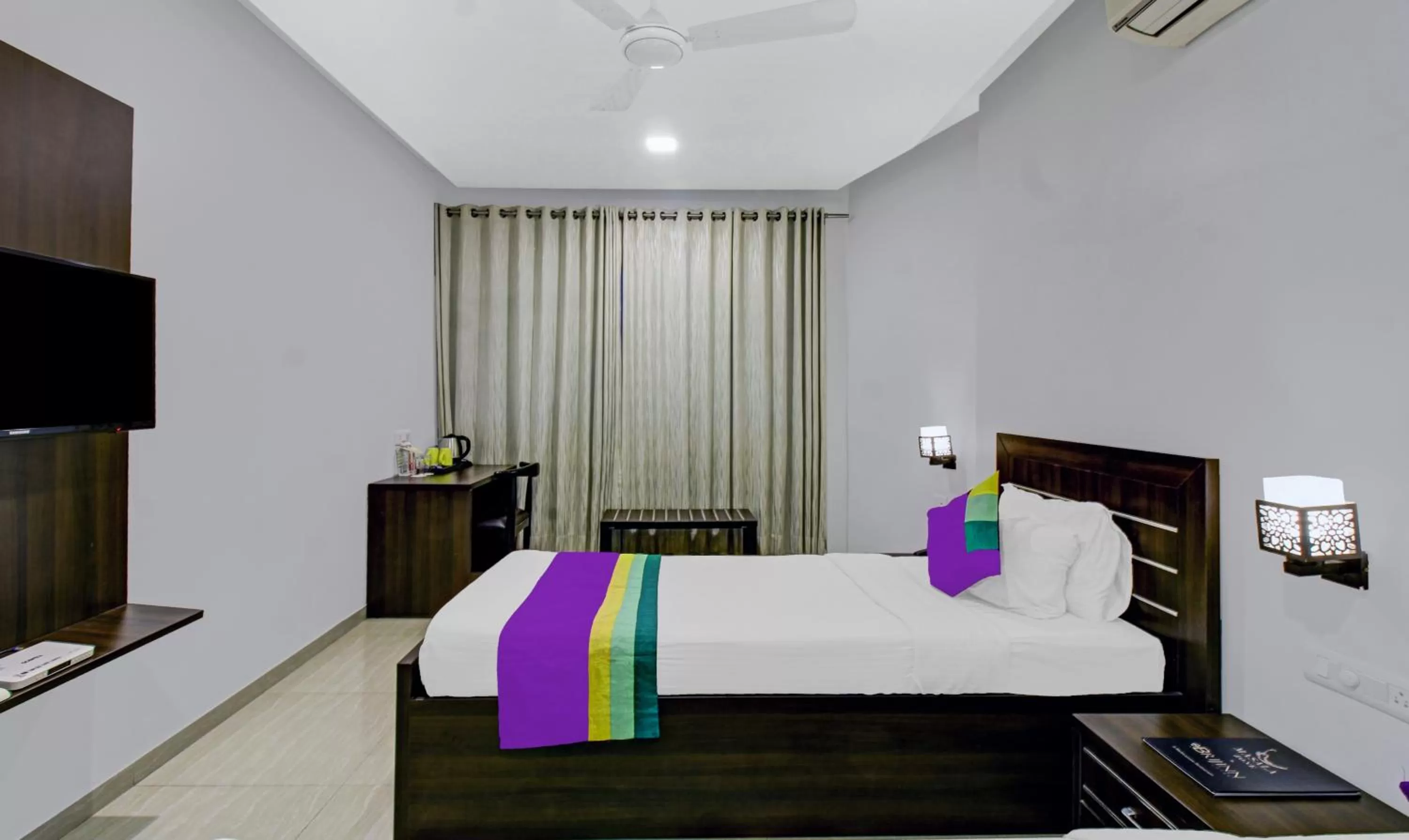 Bedroom, Bed in Treebo Premium Brijinn