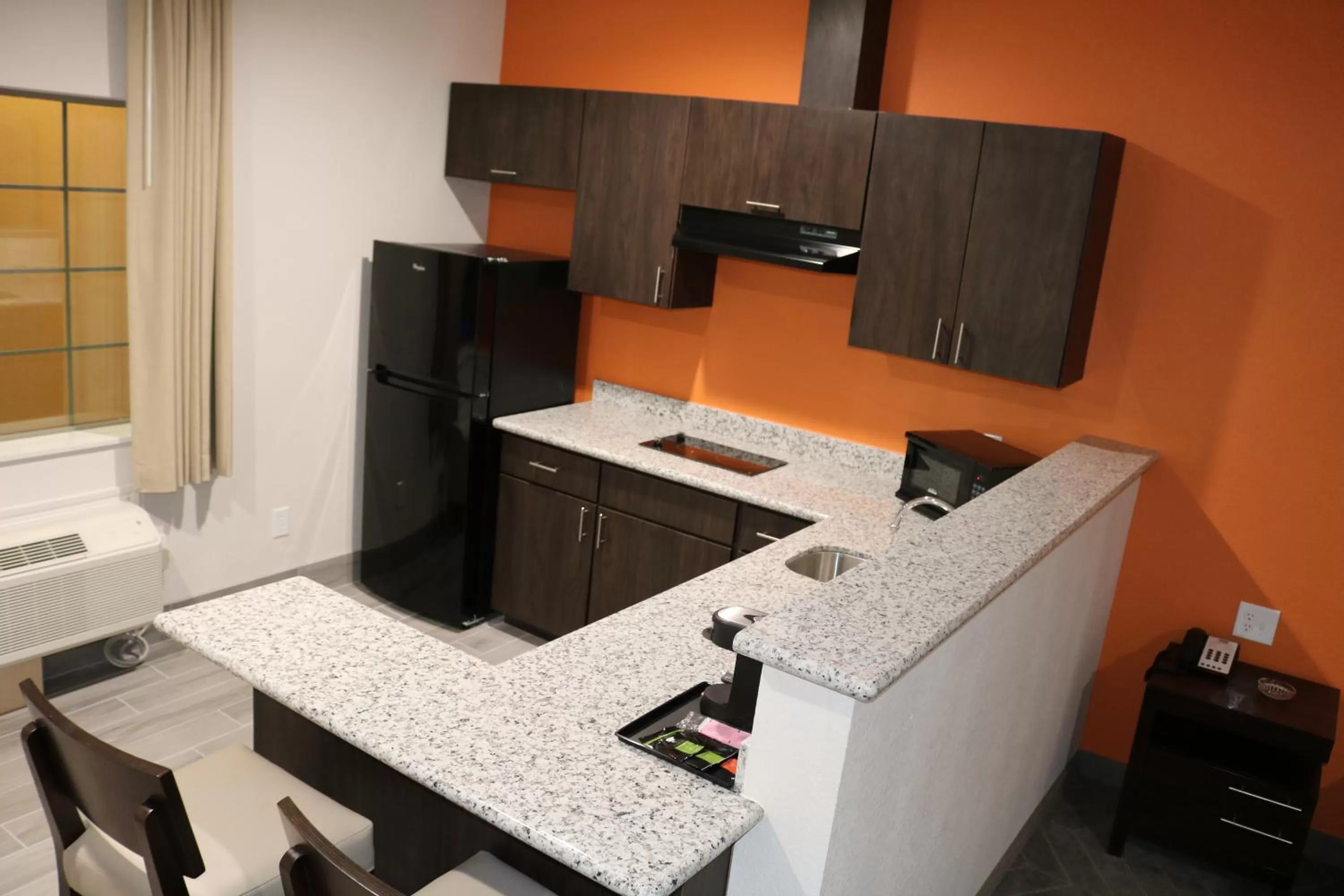 Kitchen or kitchenette in Scottish Inn & Suites - IAH Airport