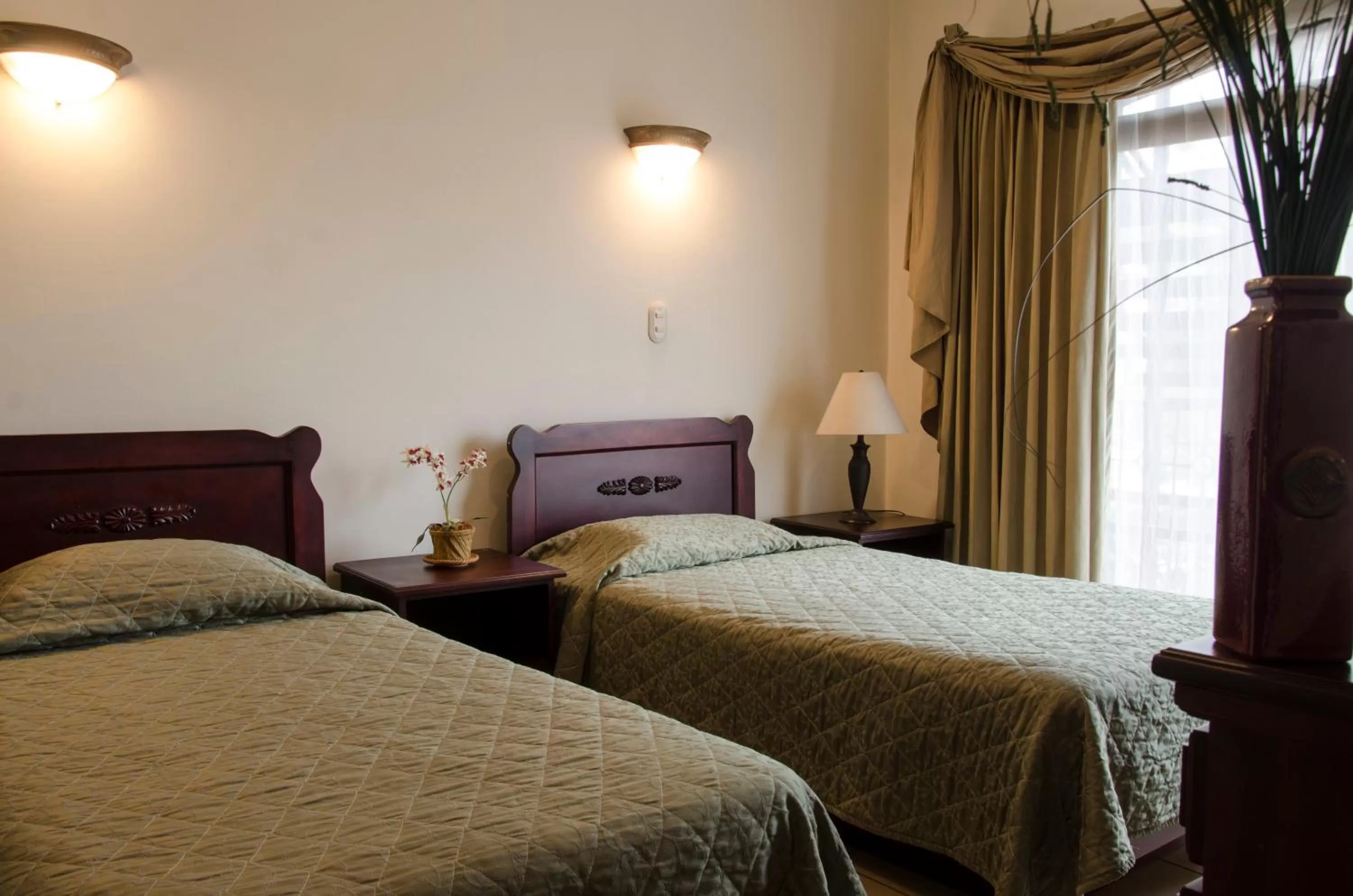 Bedroom, Bed in Hotel Plaza Real Suites & Apartments San Jose