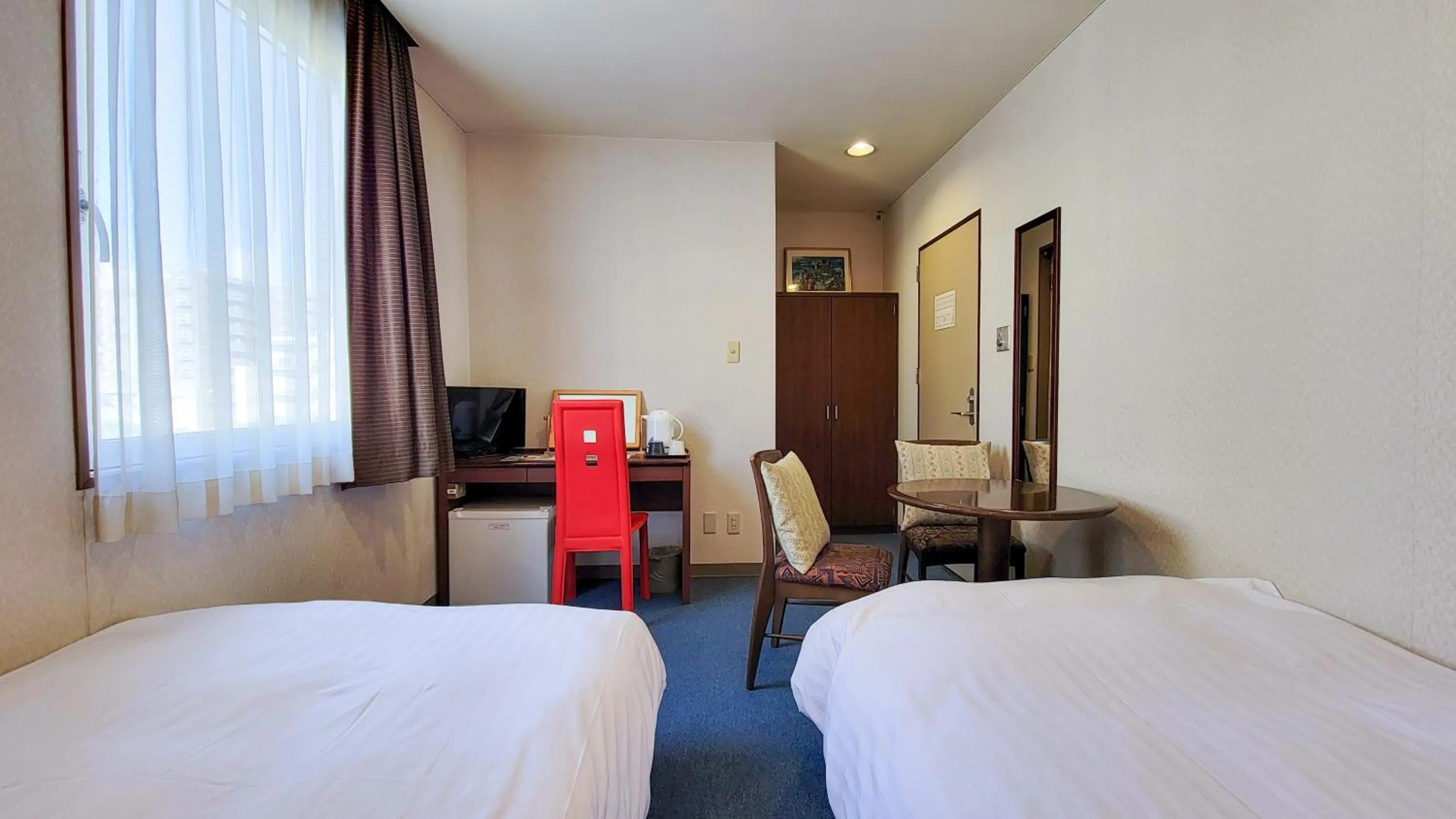 Bed in Hotel Palms Tenmonkan