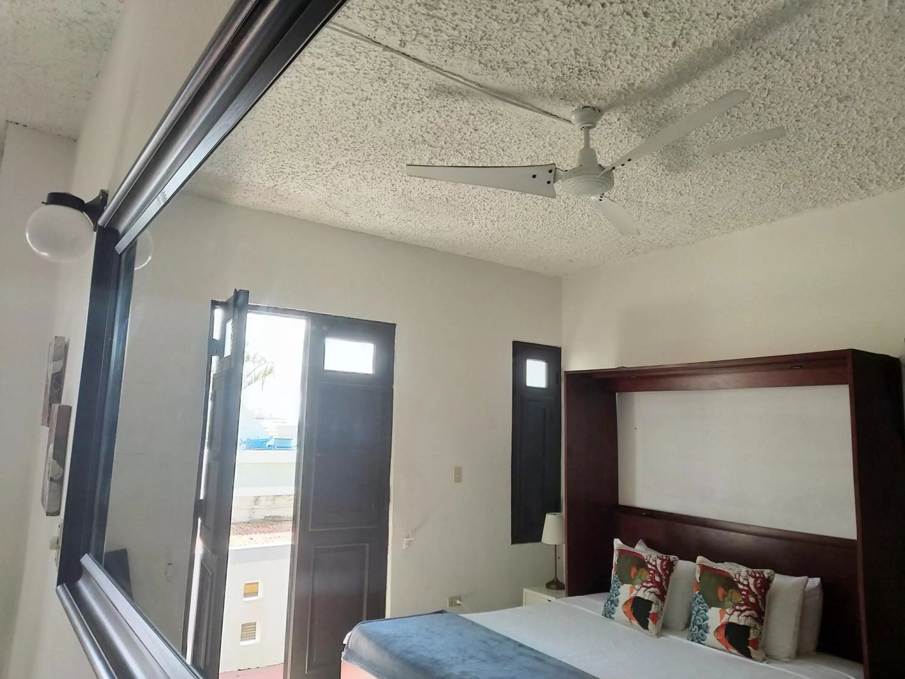 Bed in La Capitana Old San Juan Building