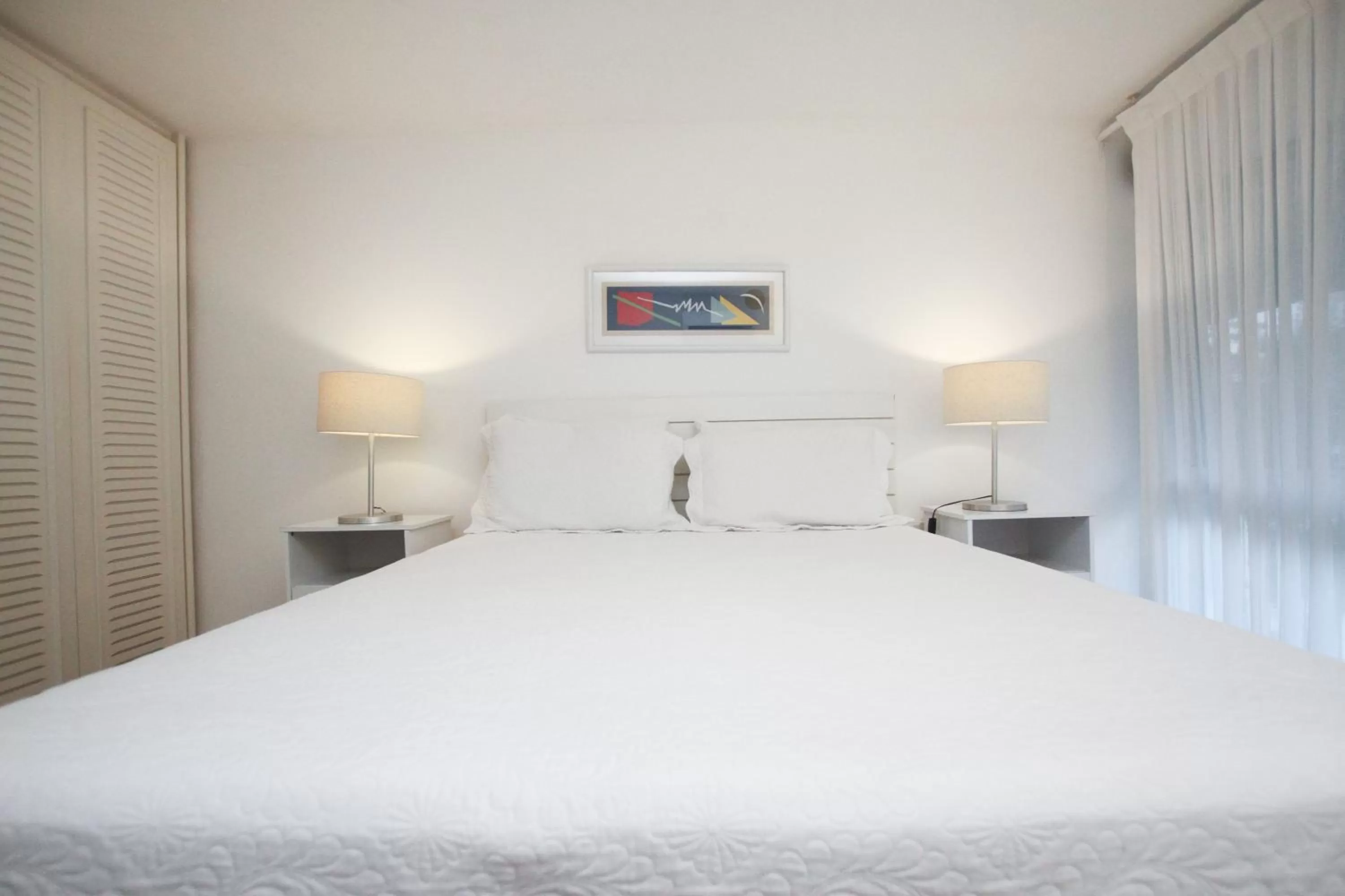 Bed in Guest House Guarujá