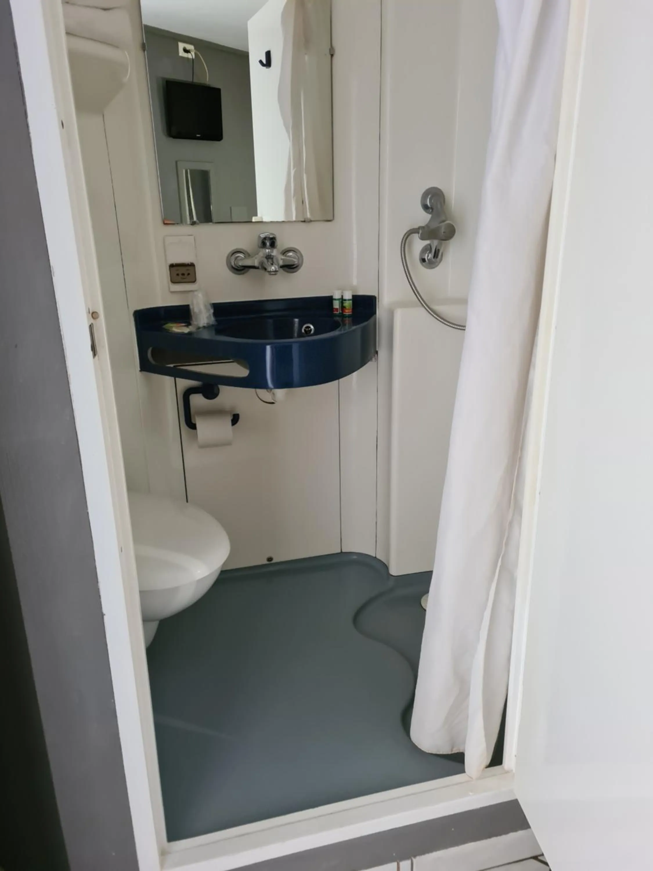 Bathroom in Initial by balladins Lyon / Chanas