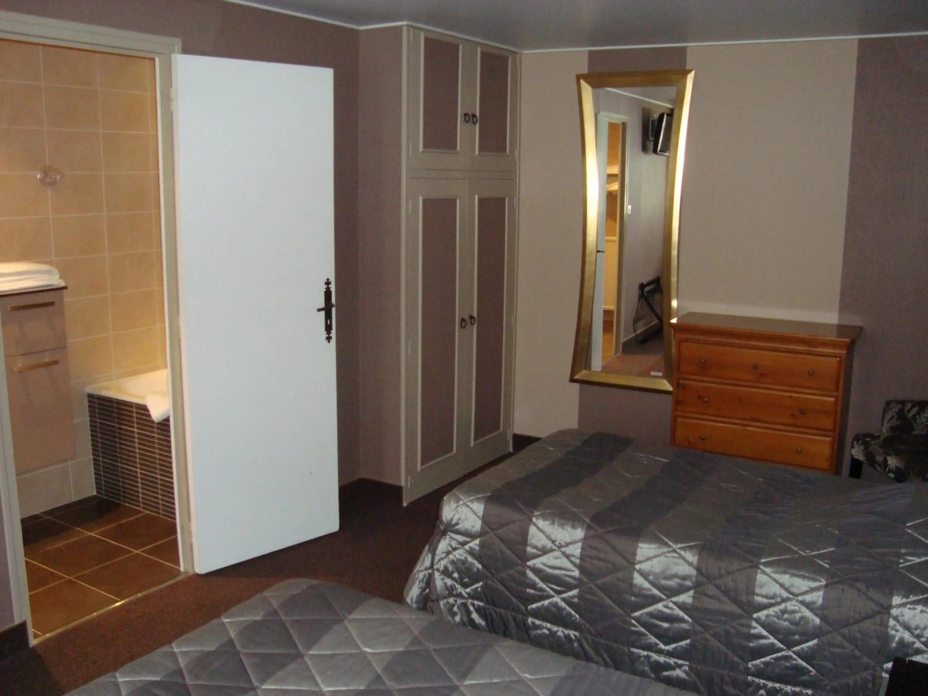 Photo of the whole room, Bed in Hôtel de La Croix d'Or