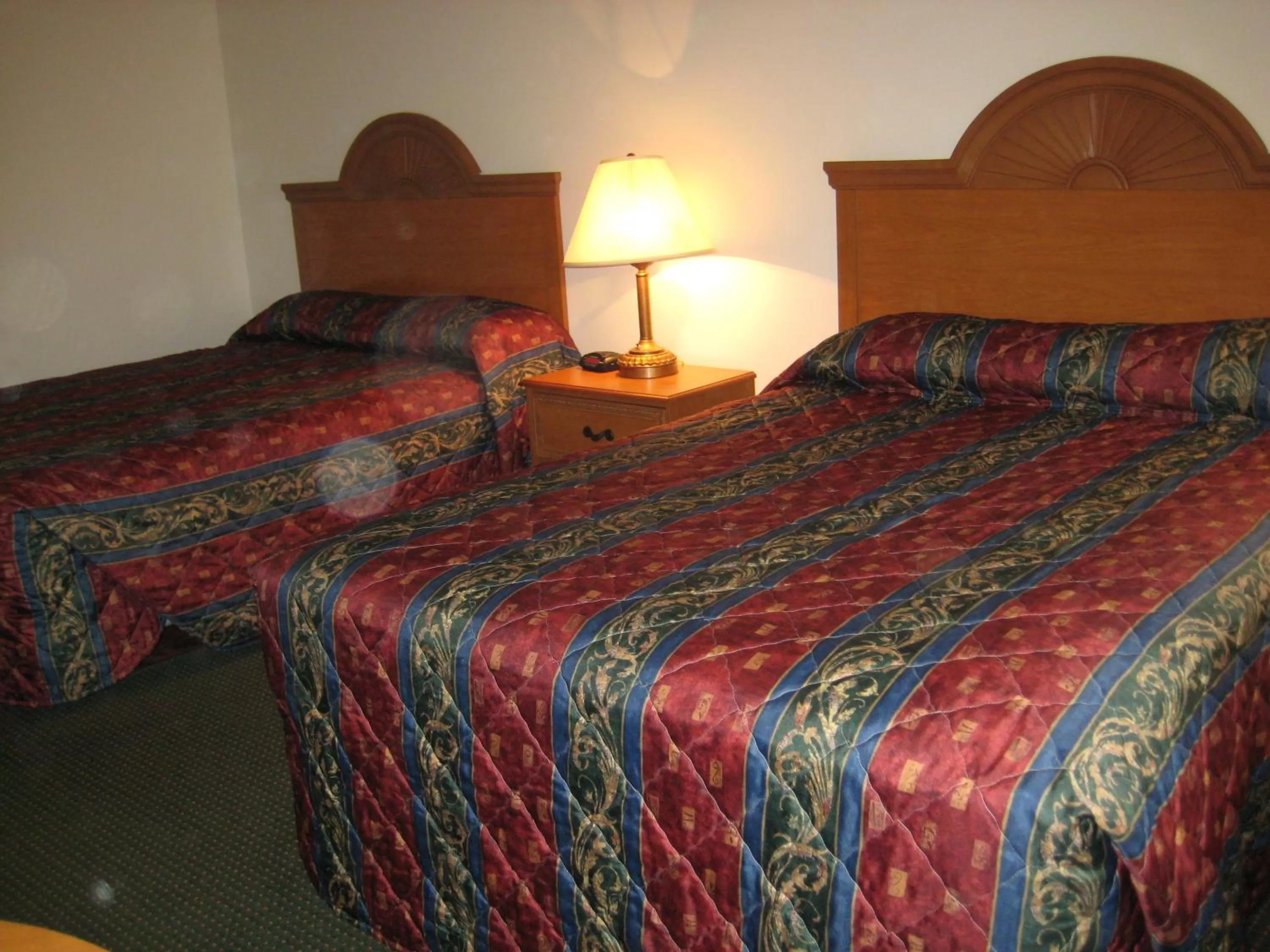 Bed in Horizon Inn & Suites