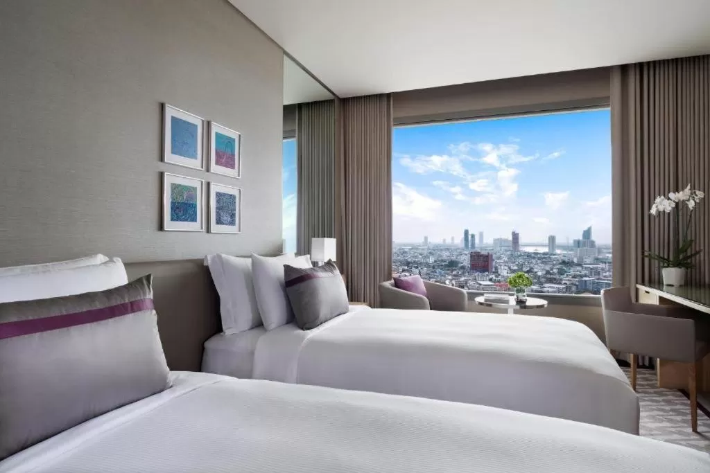 Bed in Avani Plus Riverside Bangkok Hotel