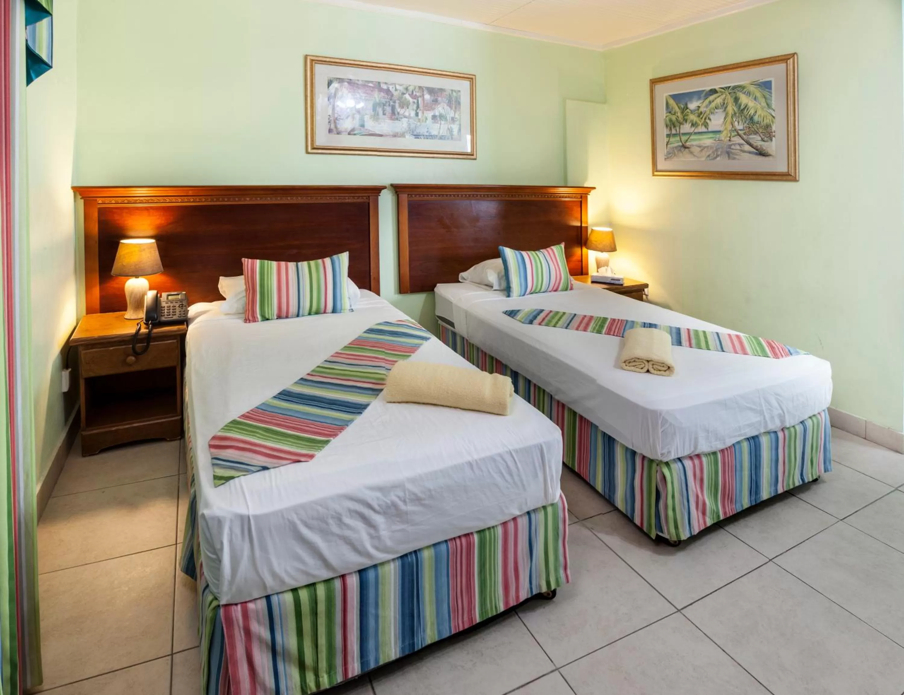 Bed in Palm Garden Hotel Barbados