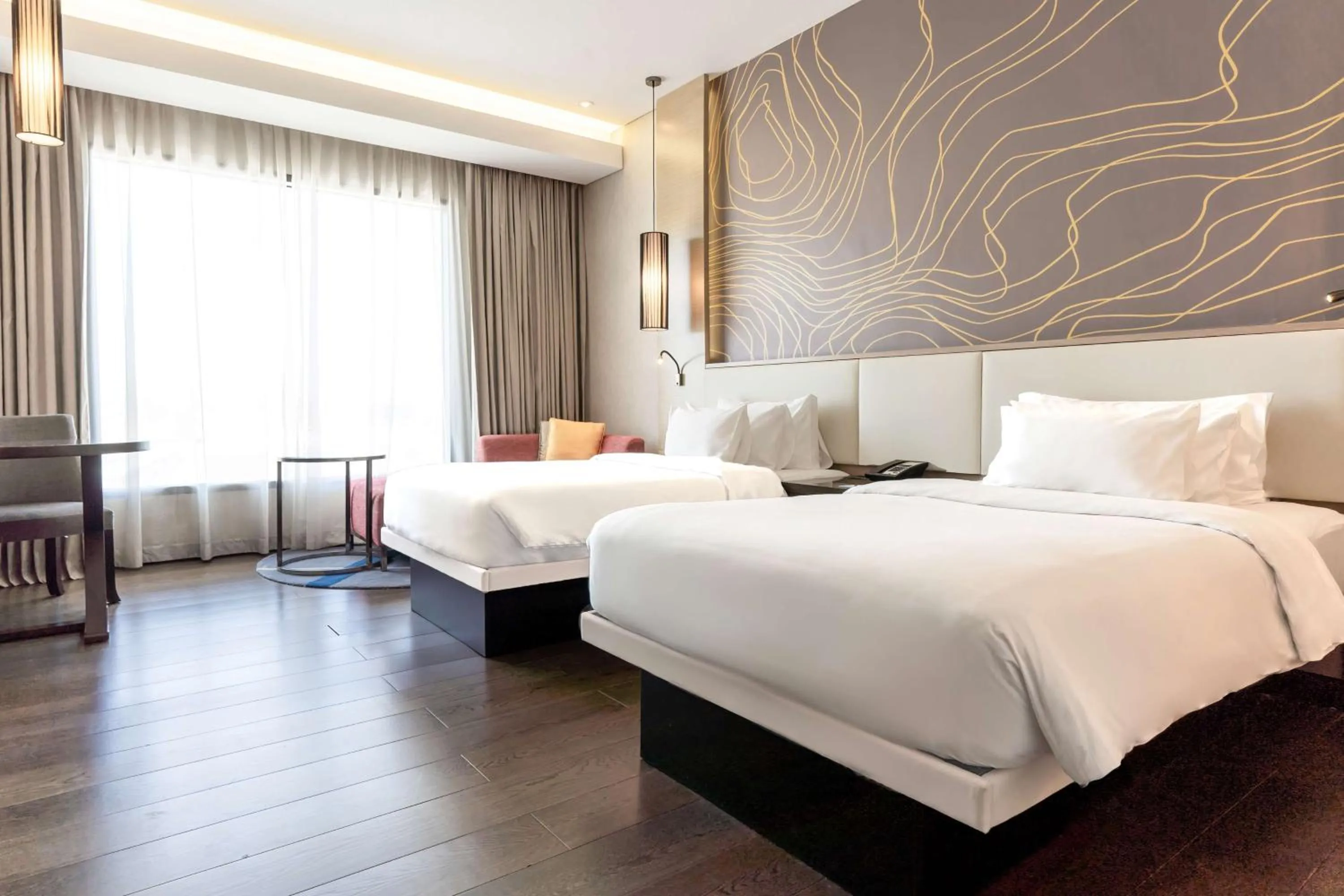 Photo of the whole room, Bed in Radisson Collection Muscat, Hormuz Grand