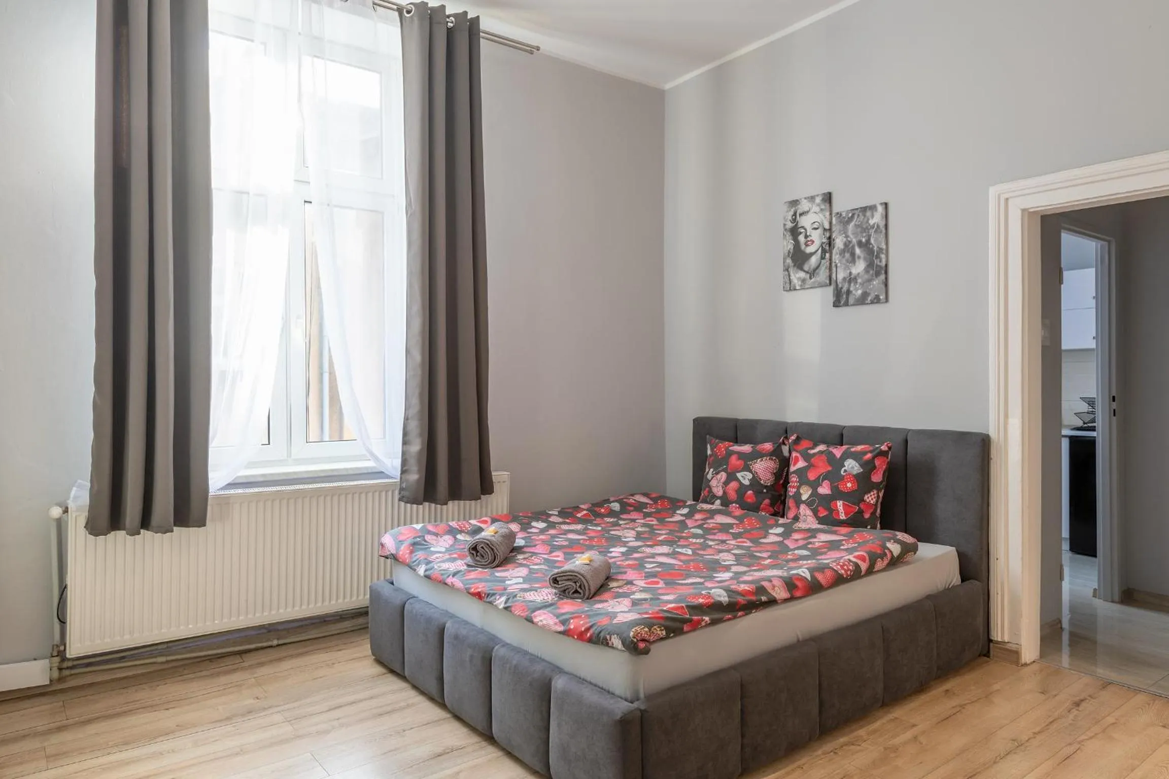 Bed in Queen Apartments